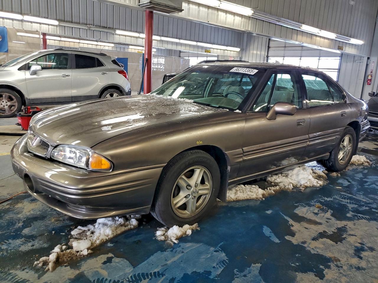 1999 Pontiac Bonneville SE, VIN 1G2HX52K6XH218289 — Side