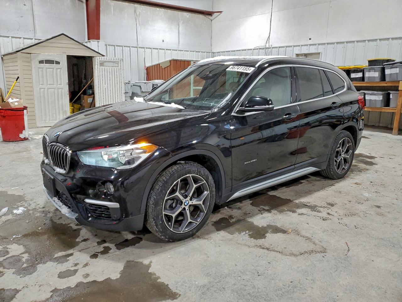 2018 BMW X1 xDrive28i, VIN WBXHT3C3XJ5K26345 — Rear end