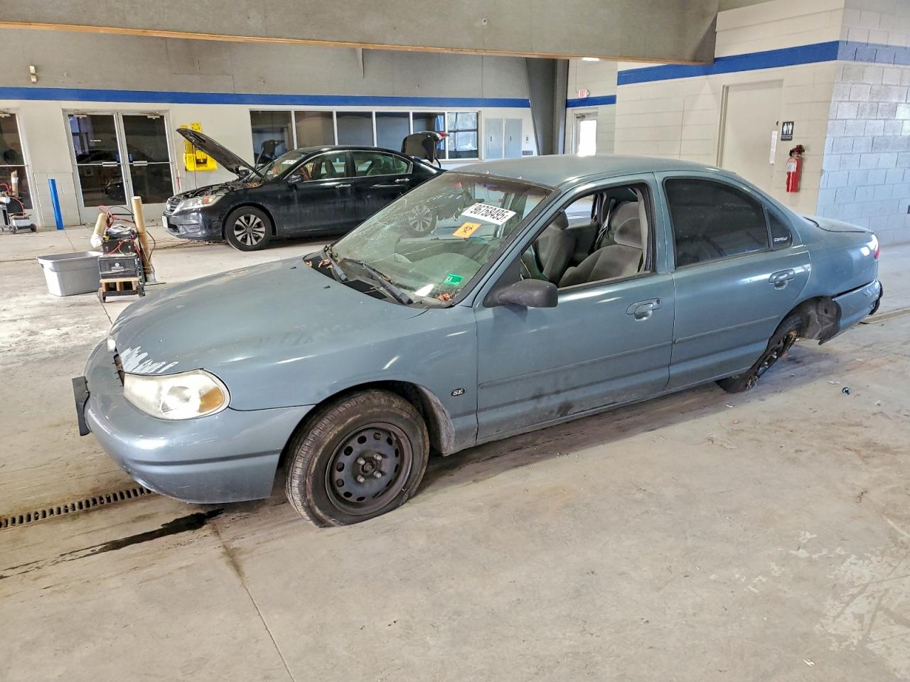 2000 Ford Contour SE Fleet, VIN 3FAFP66L3YM114986 — Side