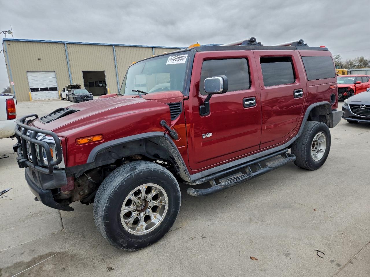 2003 Hummer H2, VIN 5GRGN23U23H149024 — Бок