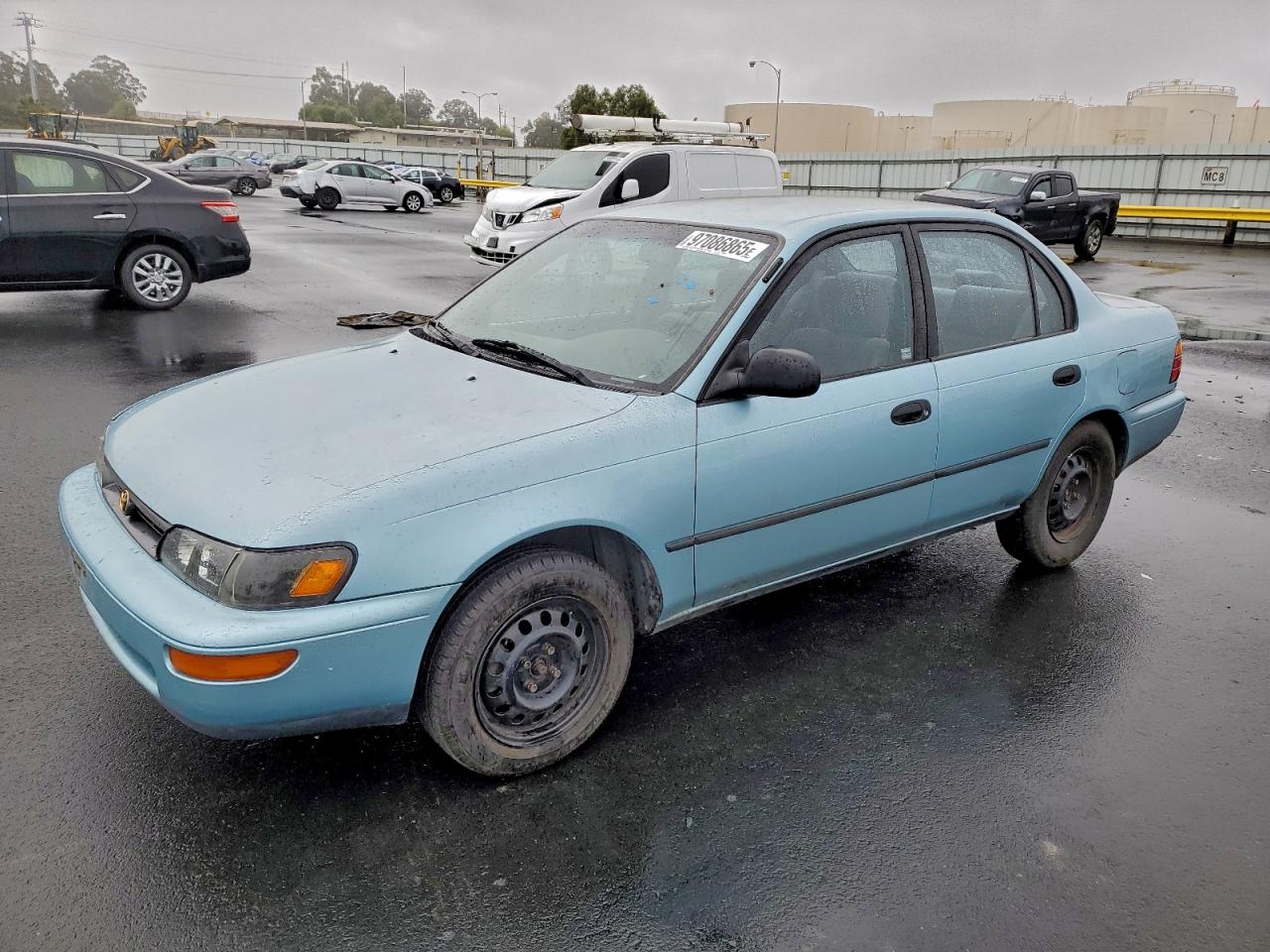 1995 Toyota Corolla DX, VIN 1NXAE09B3SZ262046 — Side