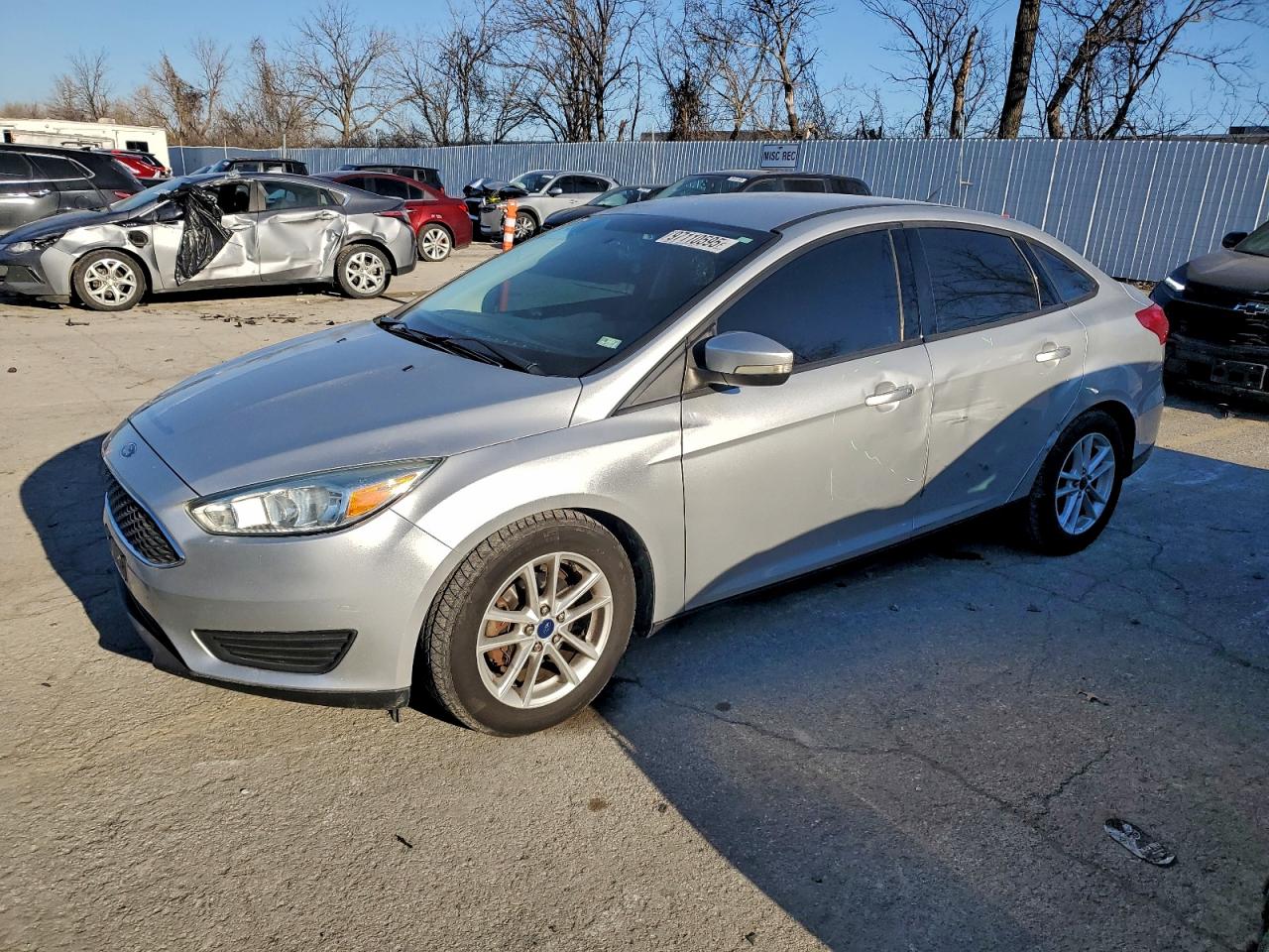 2015 Ford Focus SE, VIN 1FADP3F26FL230369 — Side