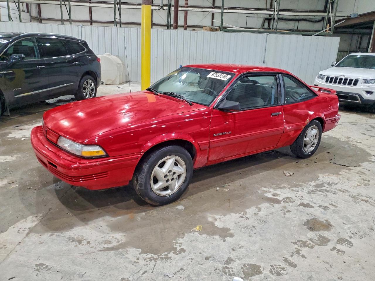 1993 Pontiac Sunbird, VIN 1G2JC14H7P7515178 — Side