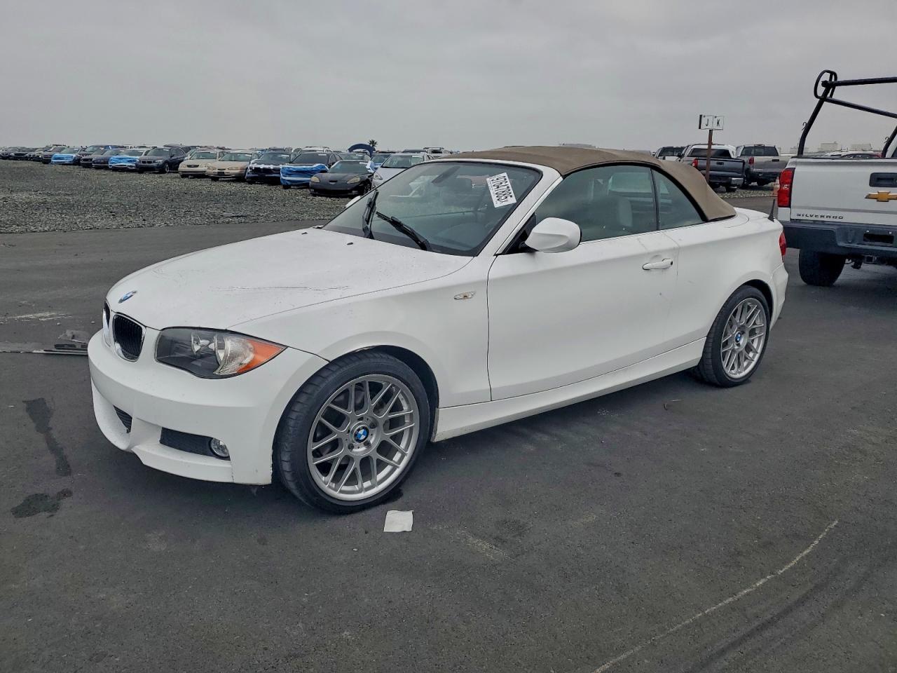 2011 BMW 1 Series 128i, VIN WBAUN1C57BVH83582 — Side