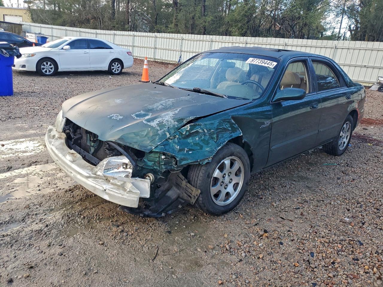 1999 Mazda 626 LX, VIN 1YVGF22D7X5852099 — Front end