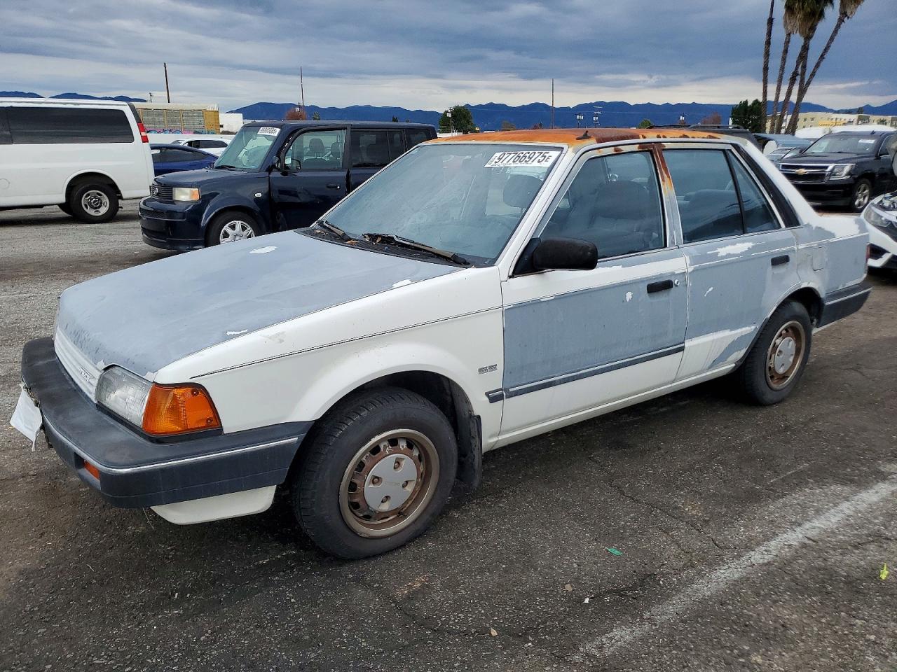 1989 Mazda 323, VIN JM1BF2221K0305575 — Minor dents and scratches