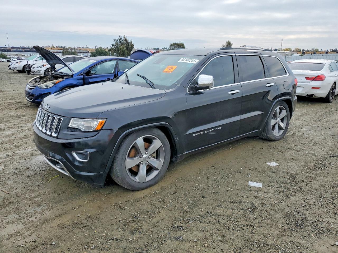2014 Jeep Grand Cherokee Overland, VIN 1C4RJFCM4EC521167 — Мелкие вмятины и царапины