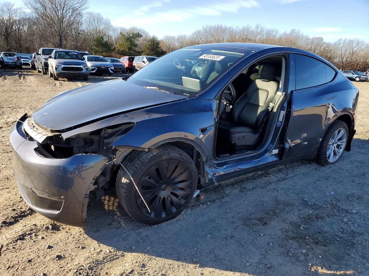 2023 Tesla Model Y Long Range, VIN 7SAYGDEE9PA201238 — Side