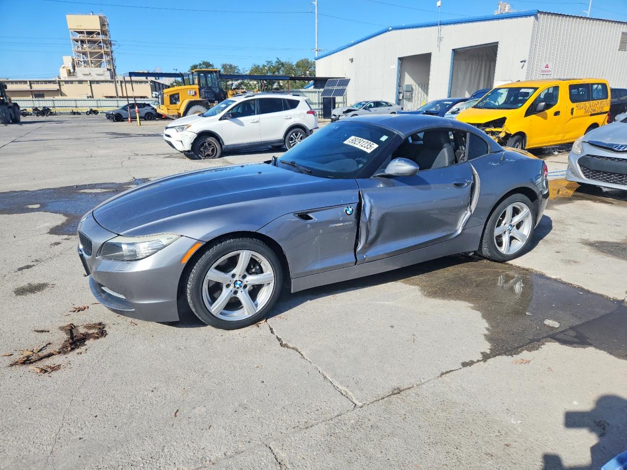 2011 BMW Z4 sDrive30i, VIN WBALM5C54BE379125 — Side