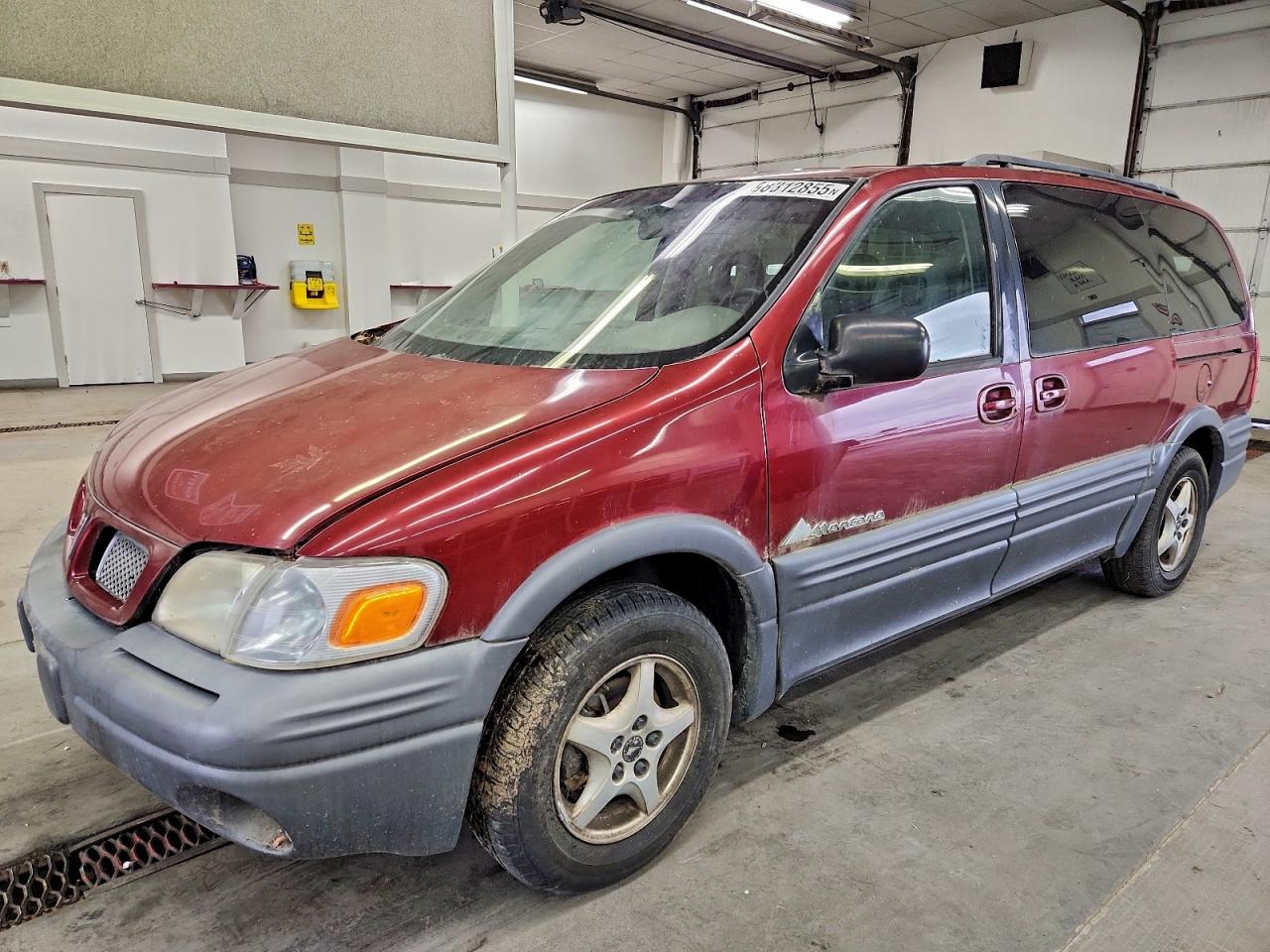 1999 Pontiac Montana, VIN 1GMDX03E1XD311536 — Side