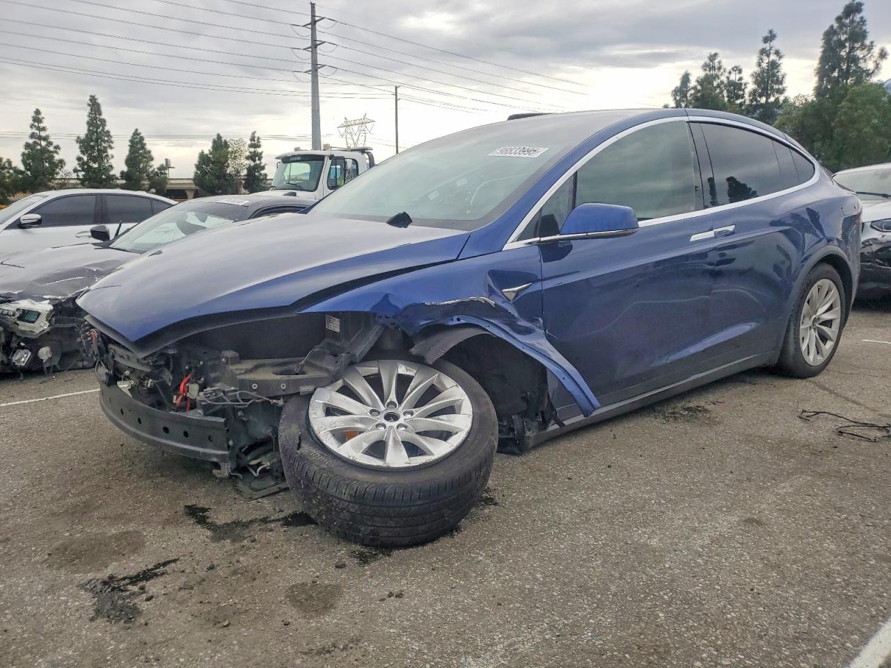 2019 Tesla Model X 75D, VIN 5YJXCAE28KF184856 — Side