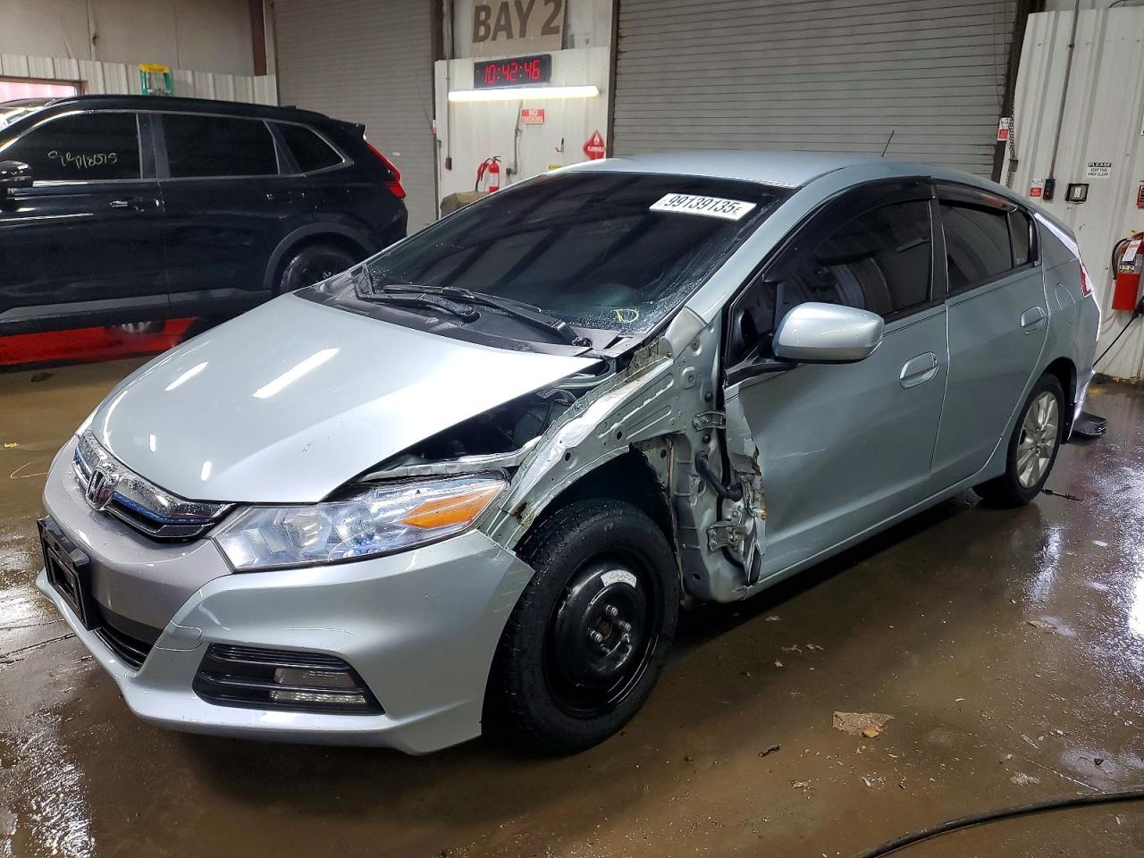 2013 Honda Insight LX, VIN JHMZE2H59DS000737 — Side
