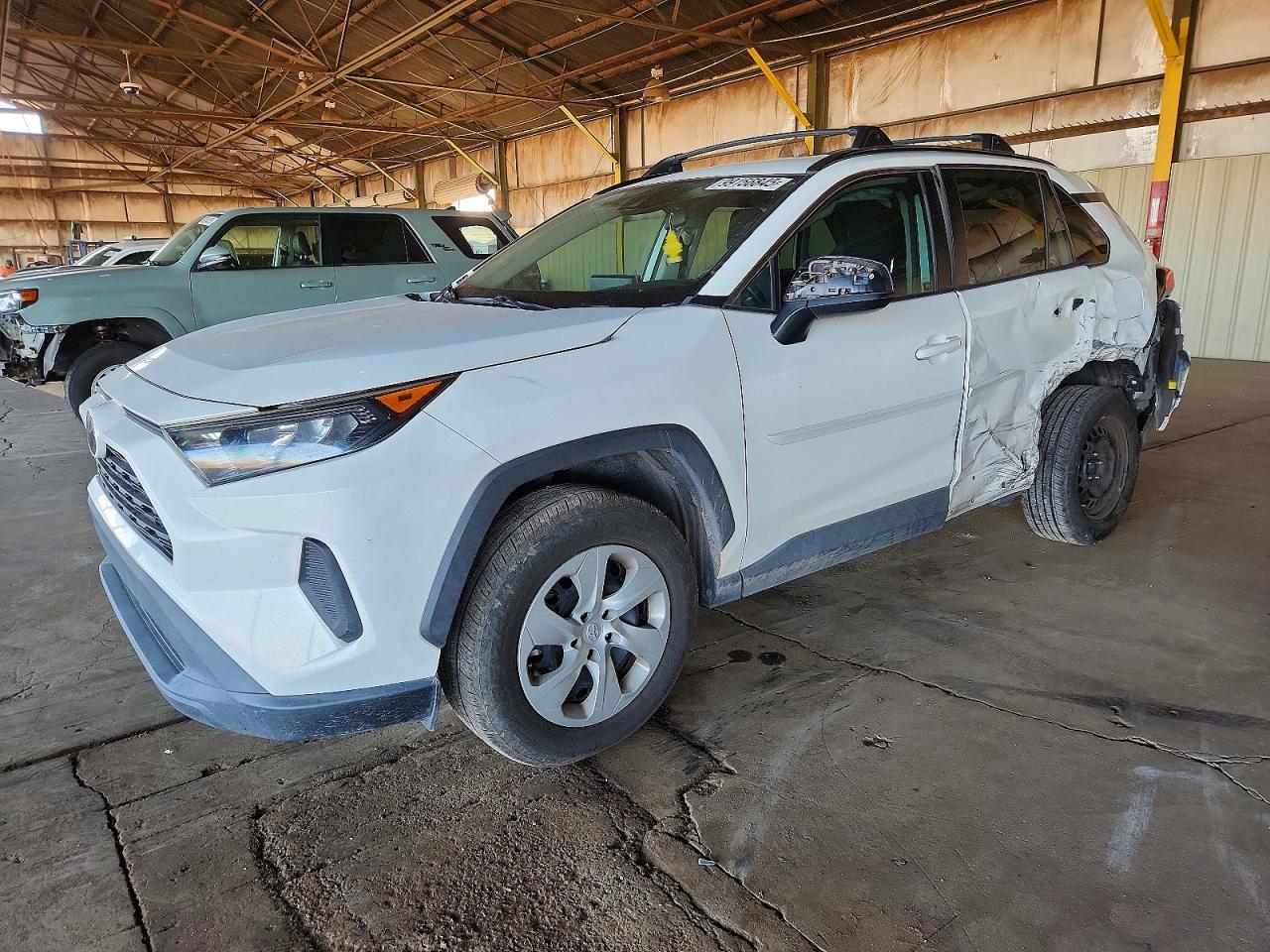 2020 Toyota RAV4 LE, VIN 2T3H1RFV9LC038903 — Side