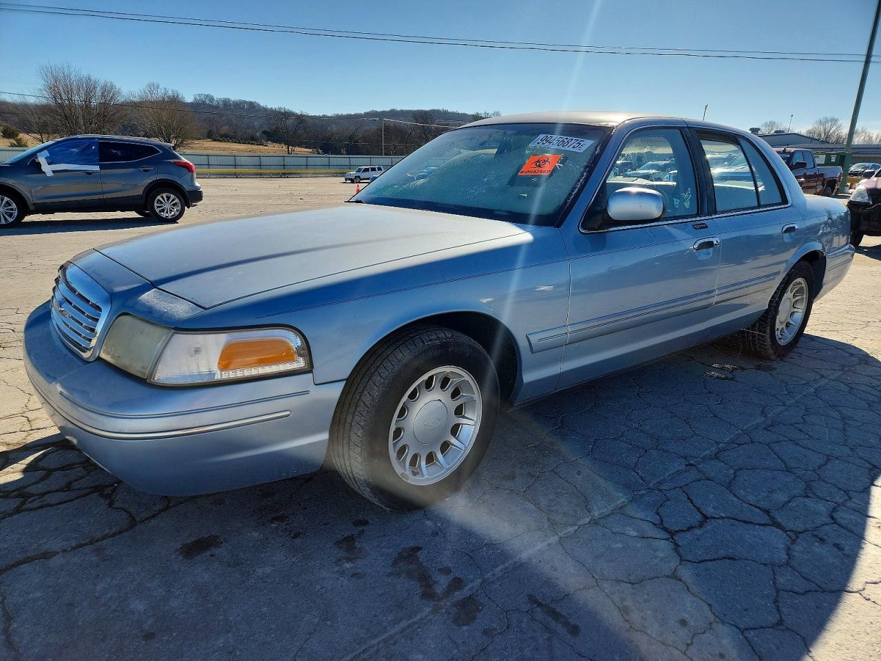 2000 Ford Crown Victoria LX, VIN 2FAFP74W8YX138403 — Side