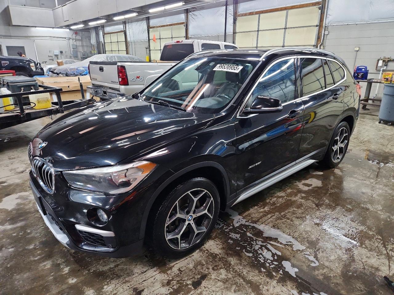 2018 BMW X1 xDrive28i, VIN WBXHT3C31J5F92200 — Hail