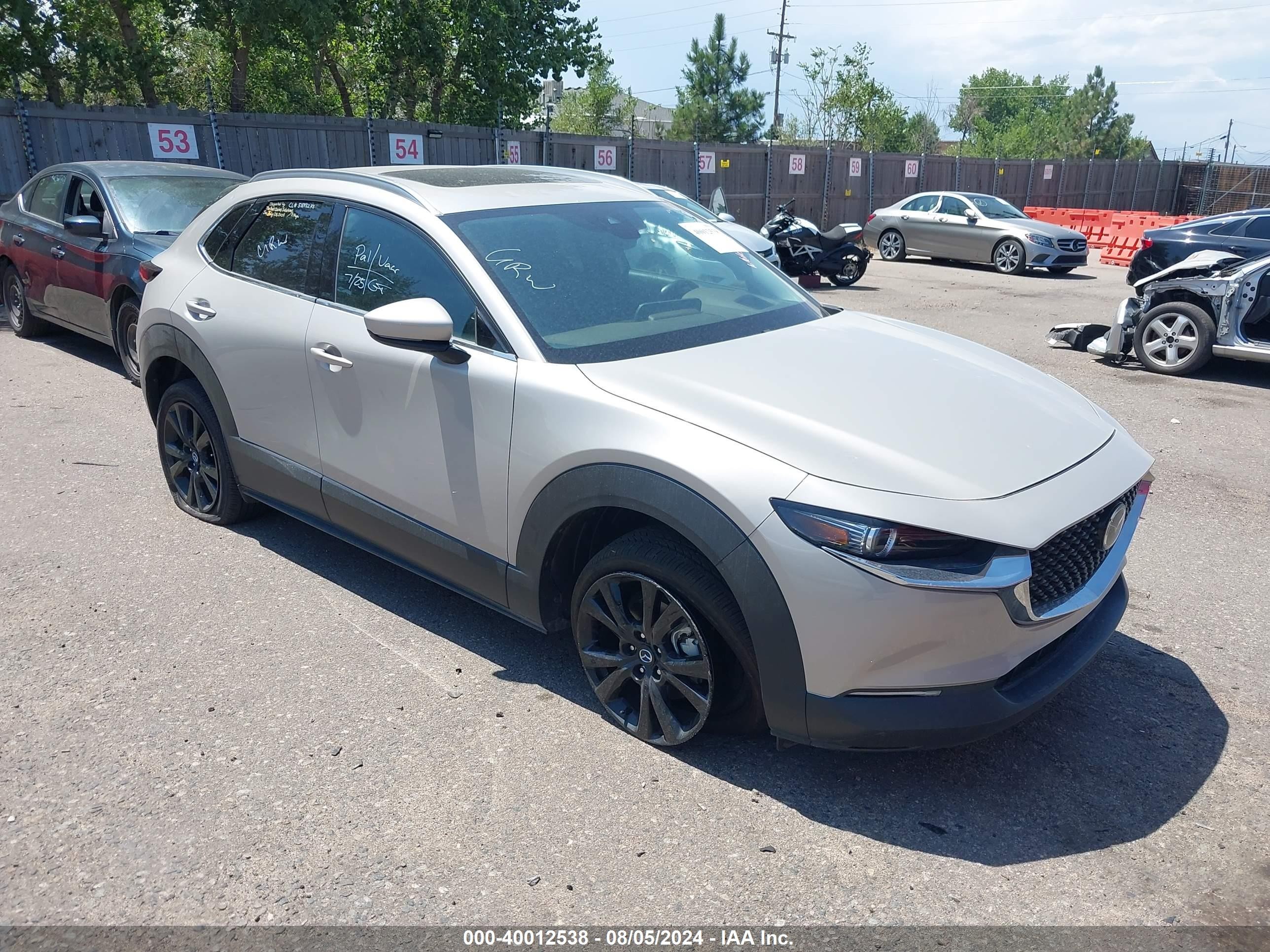 2023 Mazda CX-30 S Premium, VIN 3MVDMBDM6PM529490 — Hail