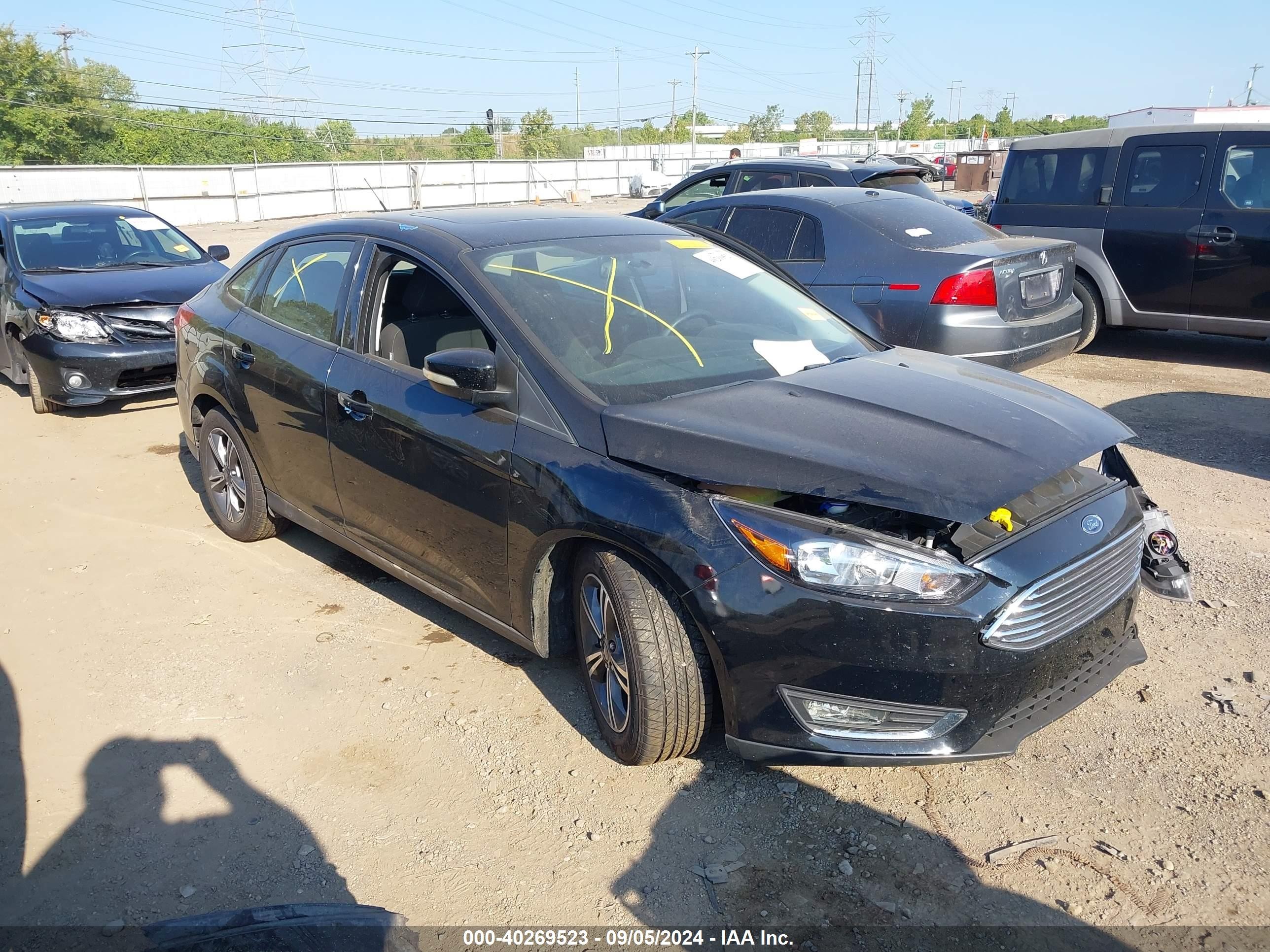 2016 Ford Focus SE, VIN 1FADP3FE3GL296891 — Side
