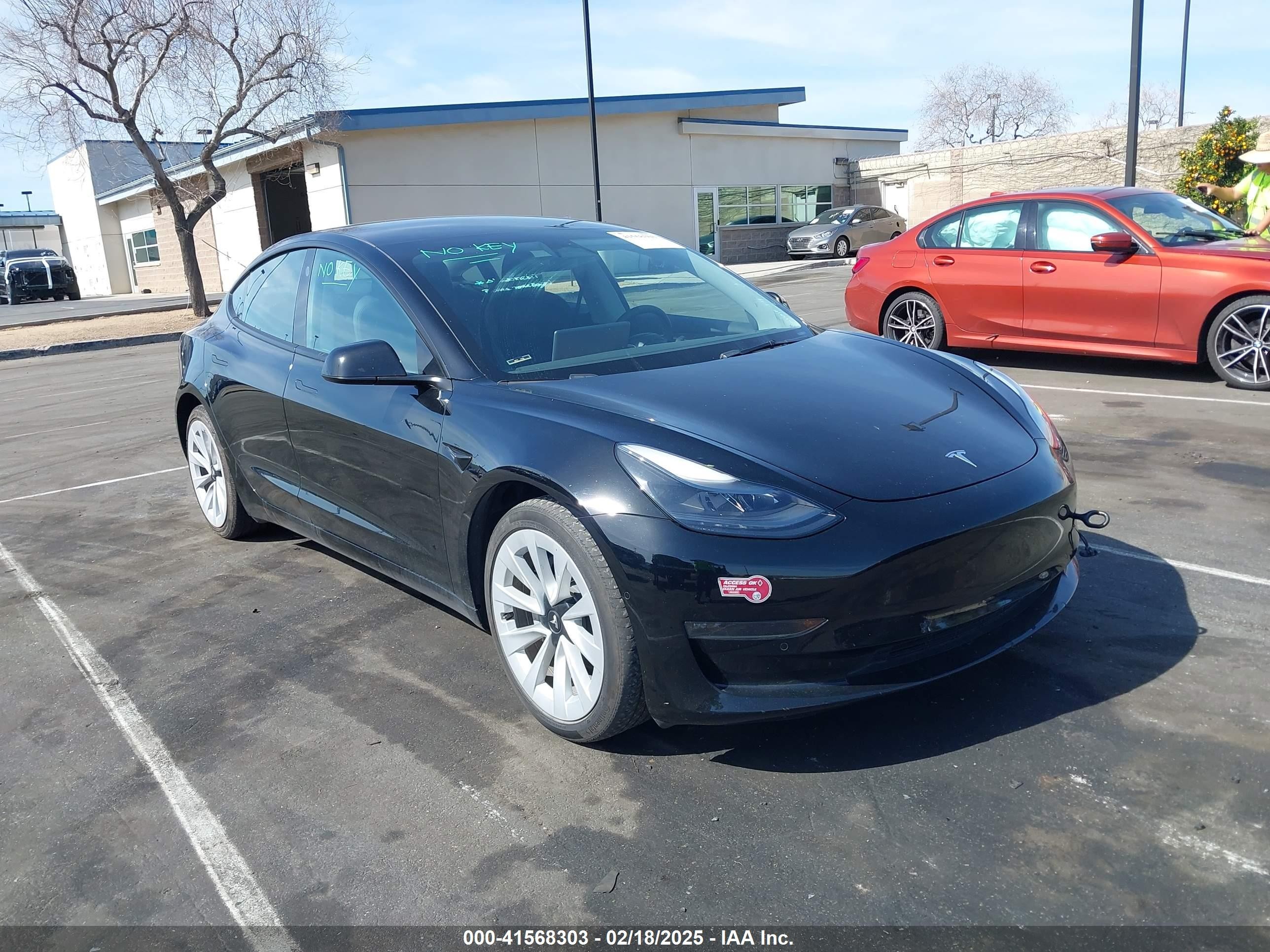 2022 Tesla Model 3 Long Range, VIN 5YJ3E1EB1NF133356 — Side