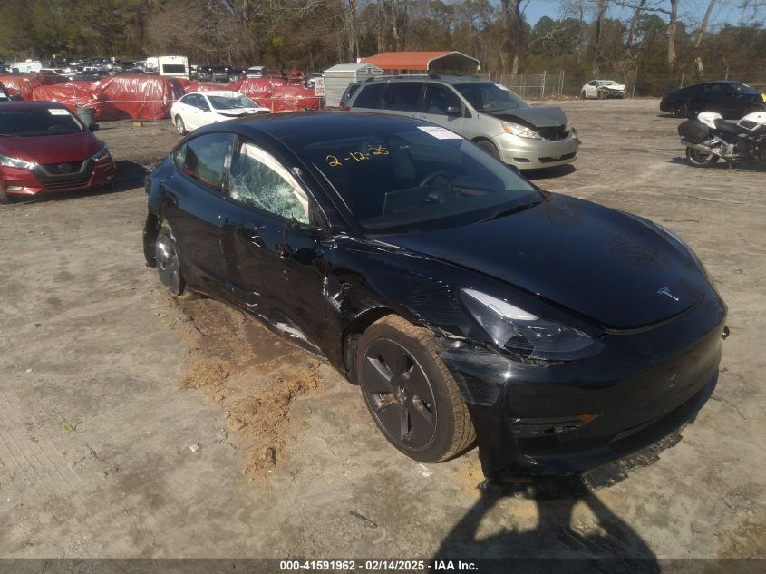 2022 Tesla Model 3 Long Range, VIN 5YJ3E1EB3NF334059 — Side