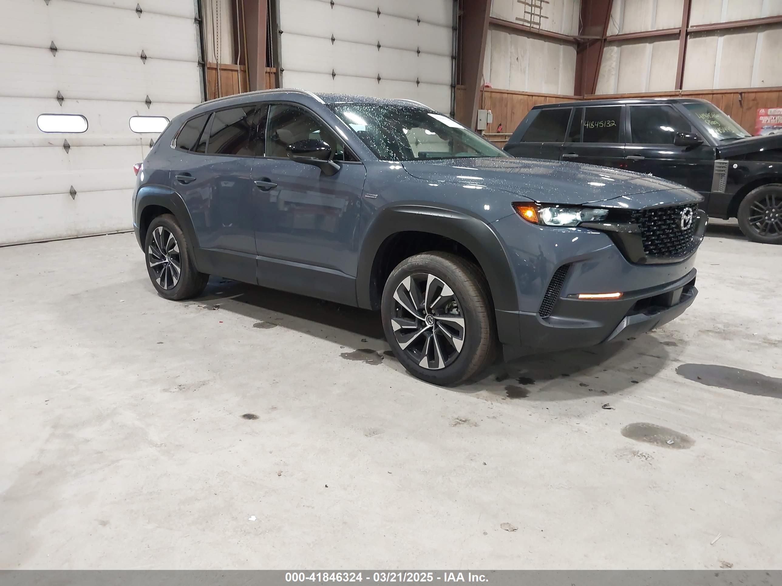 2025 Mazda CX-50 Hybrid Premium Plus Package, VIN 7MMVAAEW1SN102161 — Side