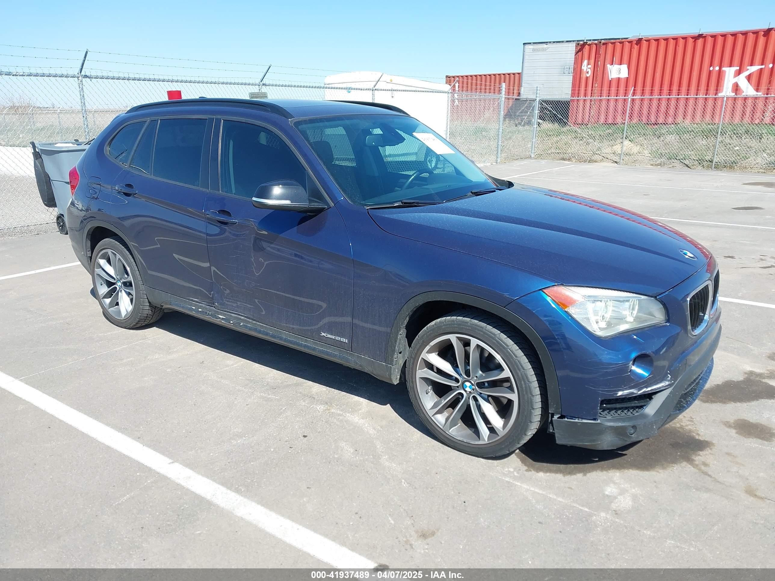 2014 BMW X1 xDrive28i, VIN WBAVL1C59EVY11720 — Side
