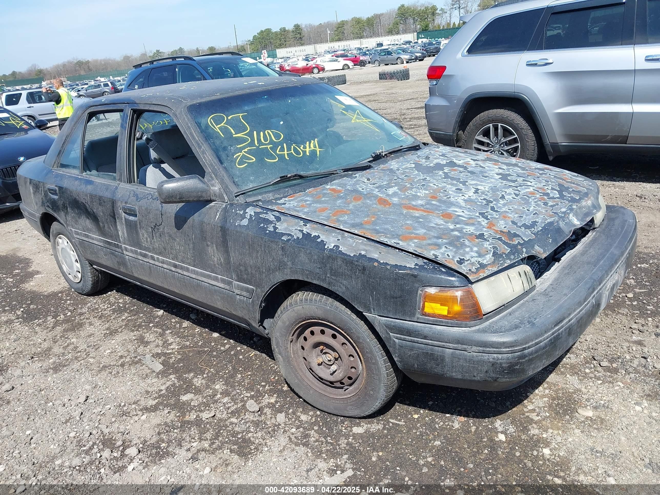 1994 Mazda Protege DX, VIN JM1BG2249R0774647 — Не указано