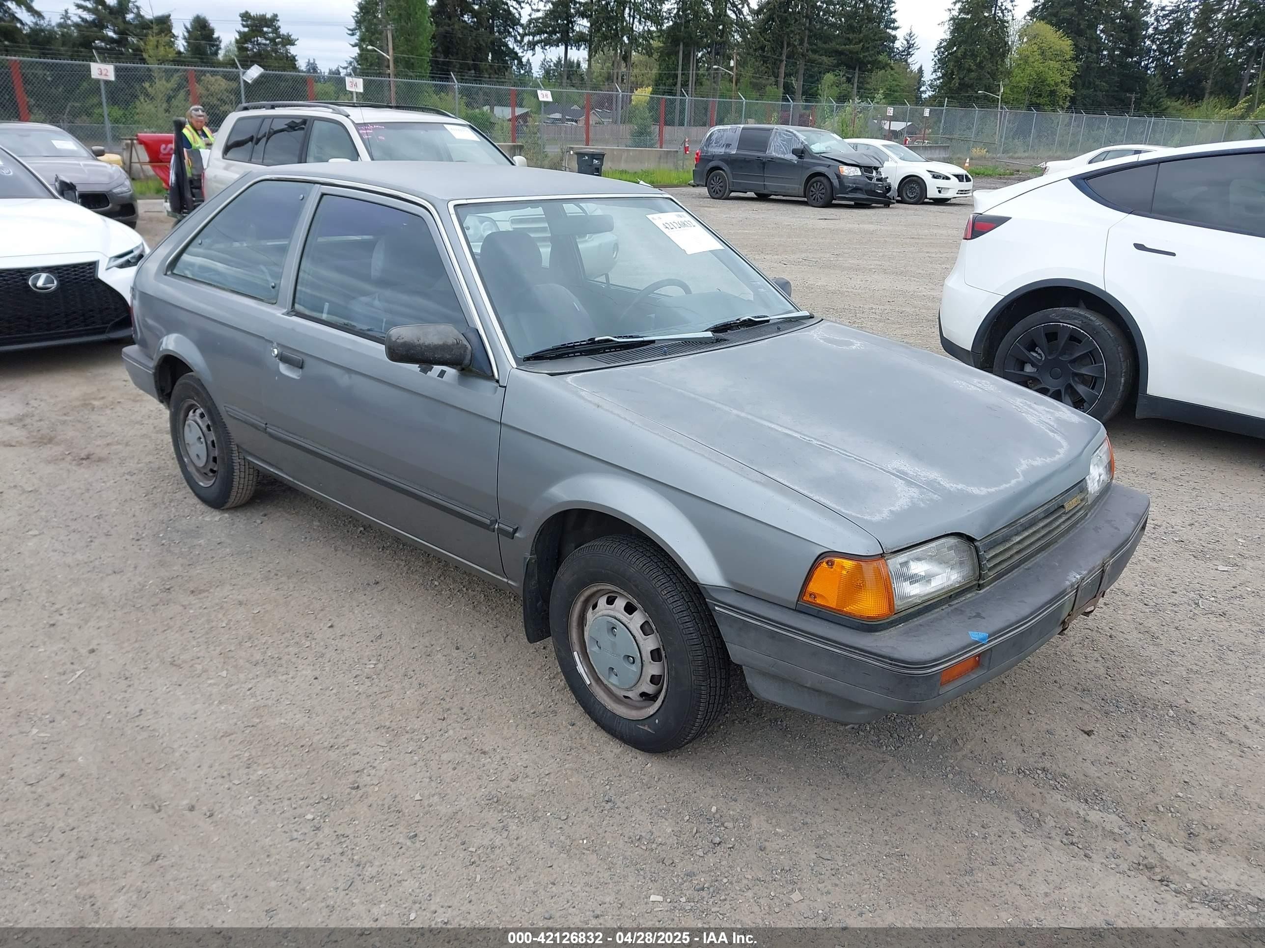 1988 Mazda 323, VIN JM1BF2321J0155836 — Side