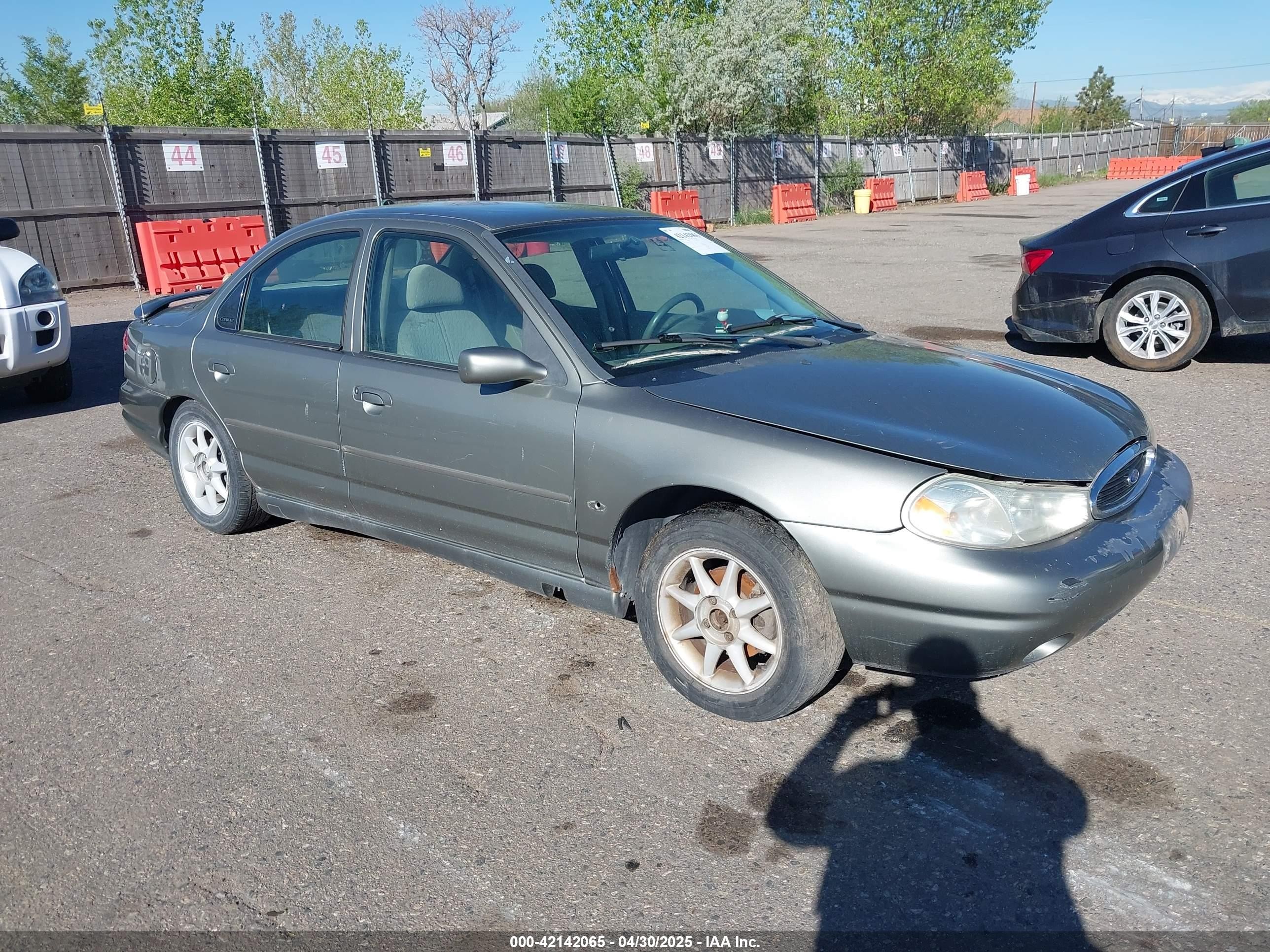 1999 Ford Contour SE Fleet, VIN 1FAFP66L7XK115659 — Hail