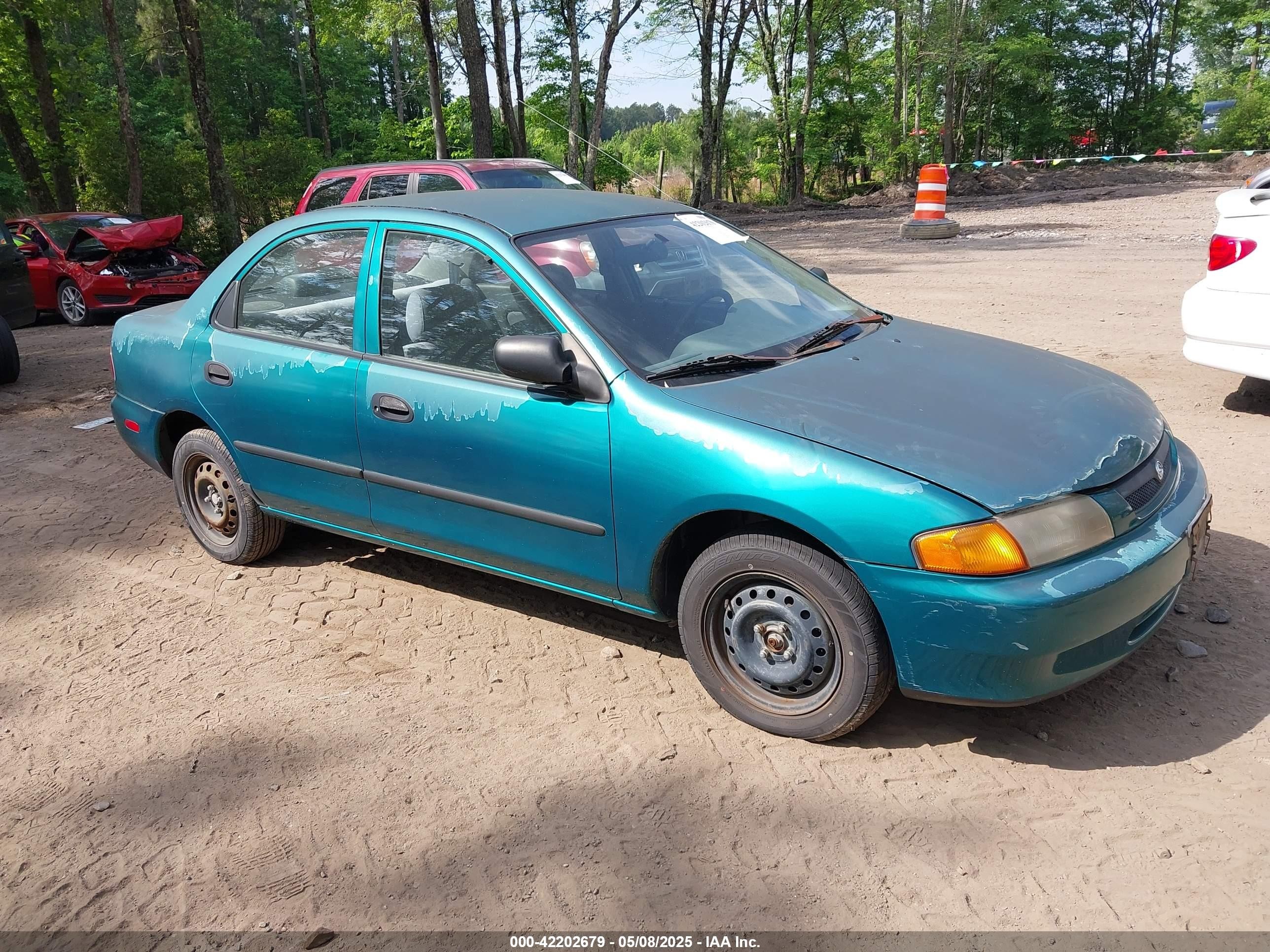 1997 Mazda Protege DX, VIN JM1BC1418V0112707 — По всему кузову