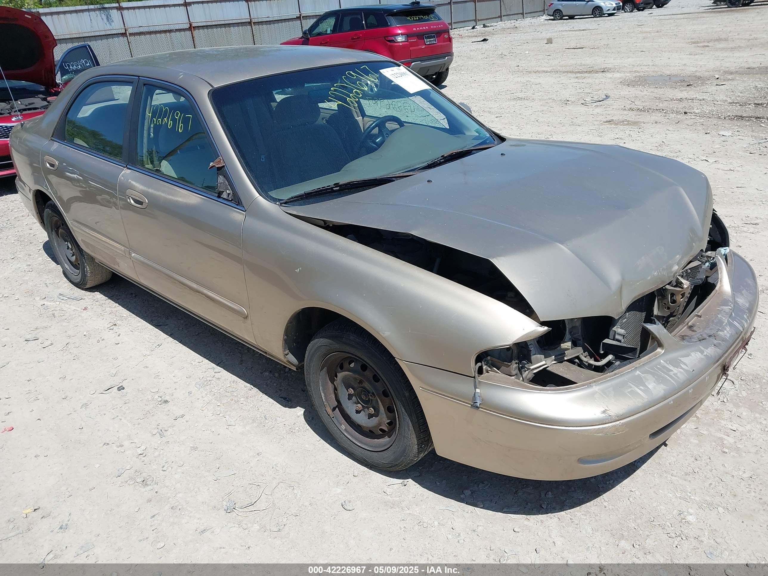 1998 Mazda 626 DX, VIN 1YVGF22C4W5770143 — Not stated