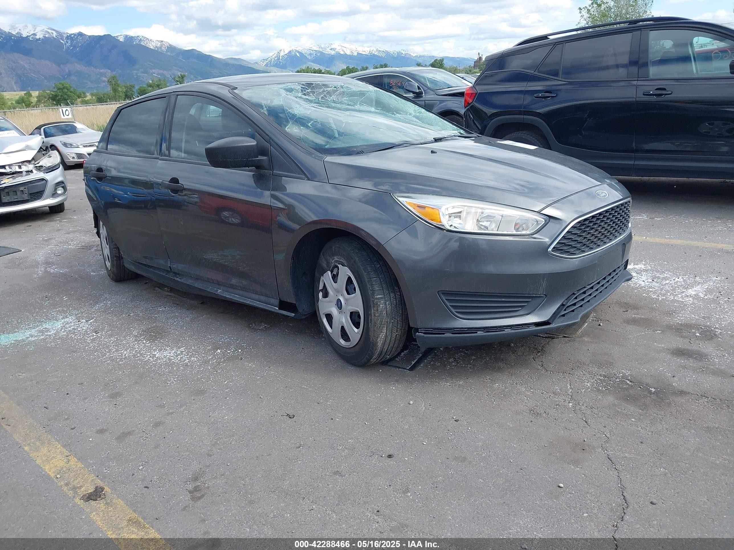2016 Ford Focus S, VIN 1FADP3E24GL379740 — Side
