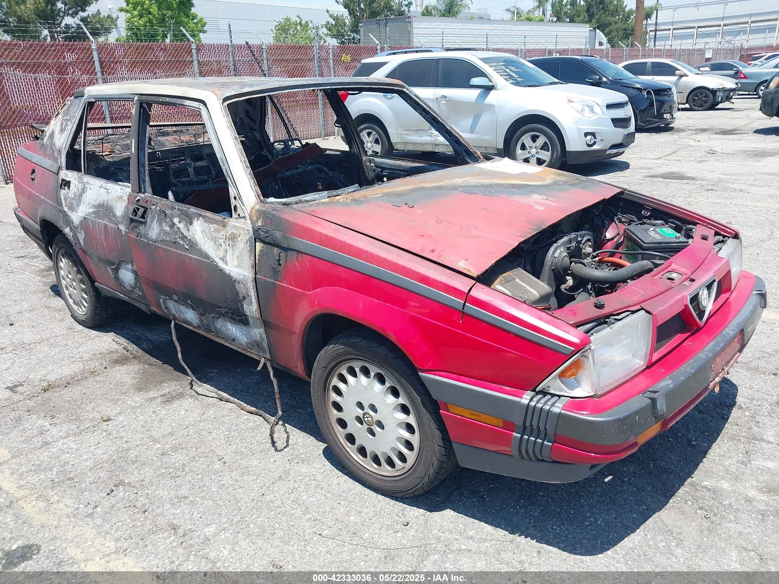 1987 Alfa Romeo Milano, VIN ZARDA116XH1052965 — Engine fire