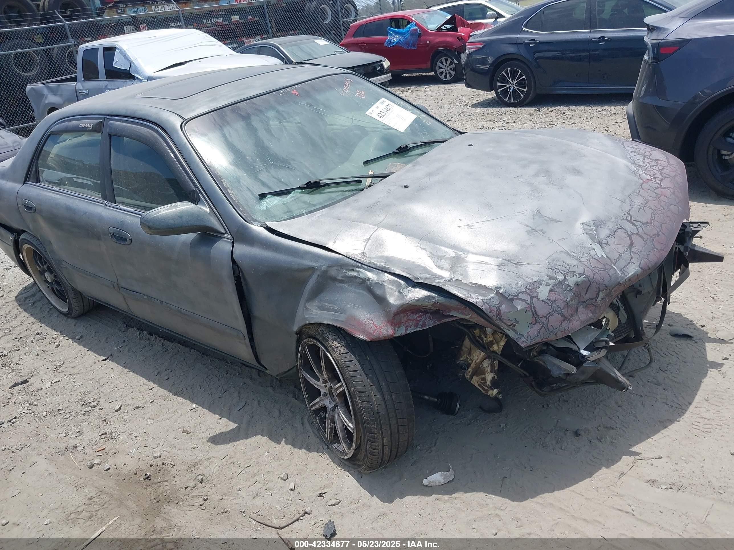 1998 Mazda 626 LX, VIN 1YVGF22D7W5707322 — Front end