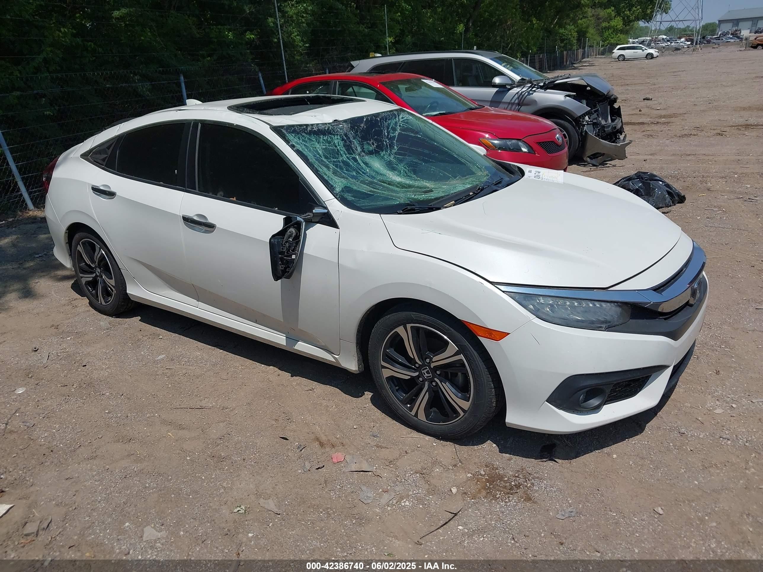 2016 Honda Civic Touring, VIN 19XFC1F91GE017419 — Storm