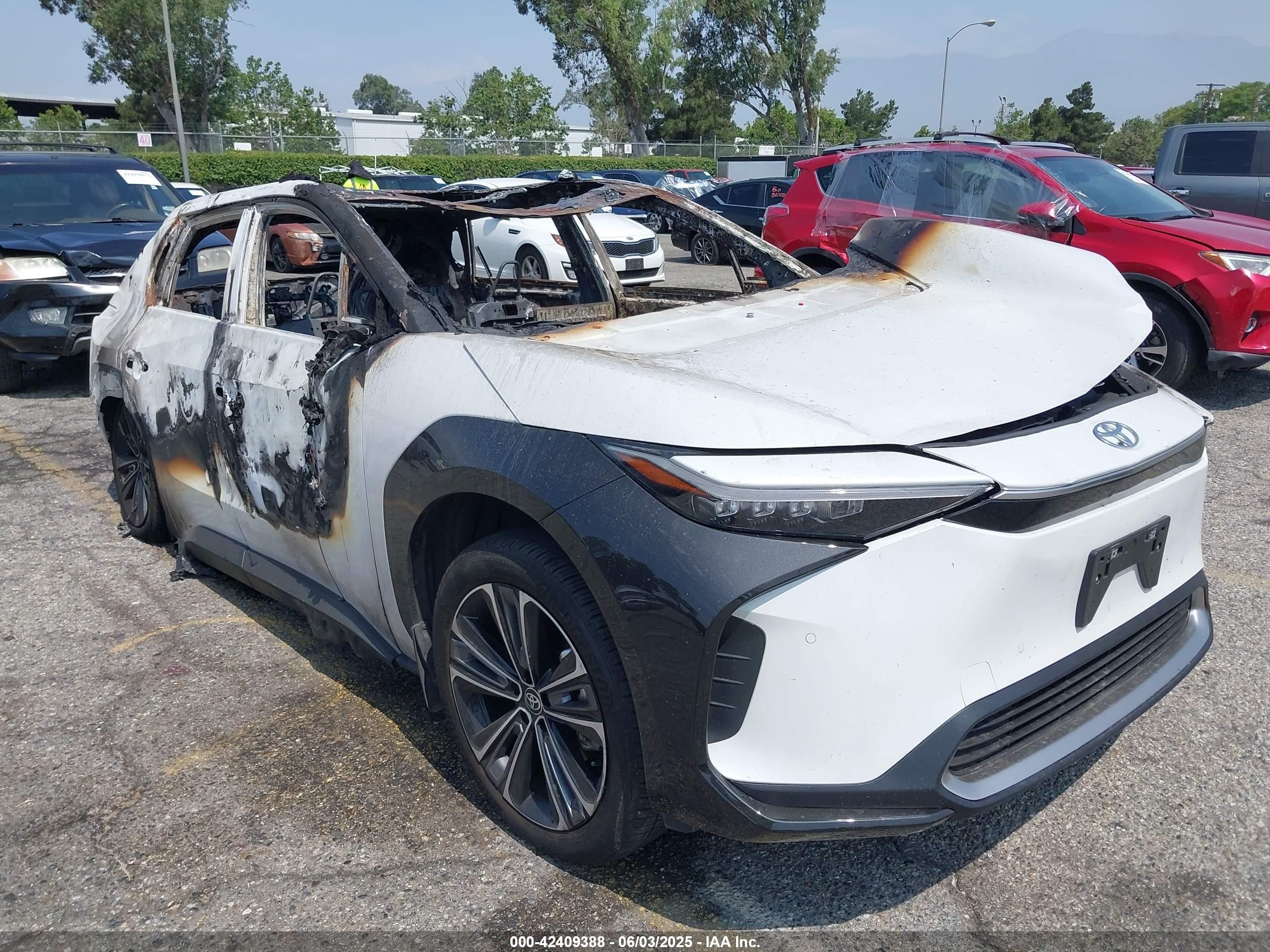 2024 Toyota bZ4X XLE, VIN JTMAAAAA1RA033563 — Burn