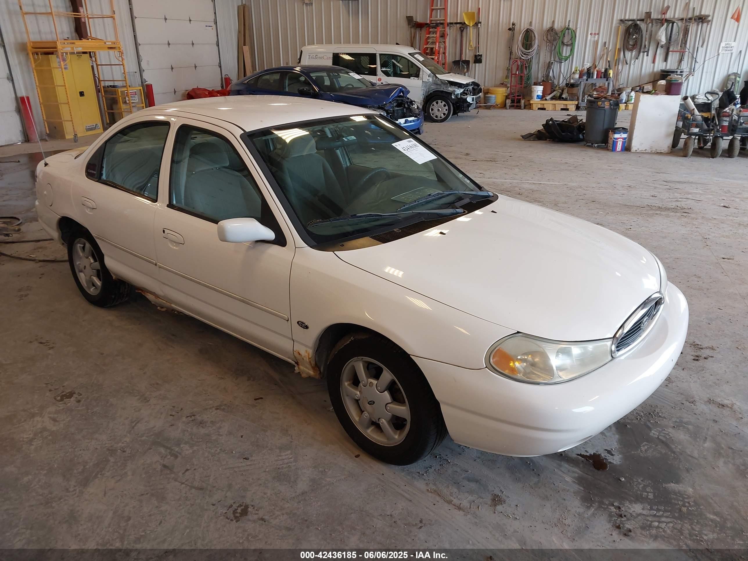 1999 Ford Contour SE, VIN 1FAFP6634XK138025 — Normal wear
