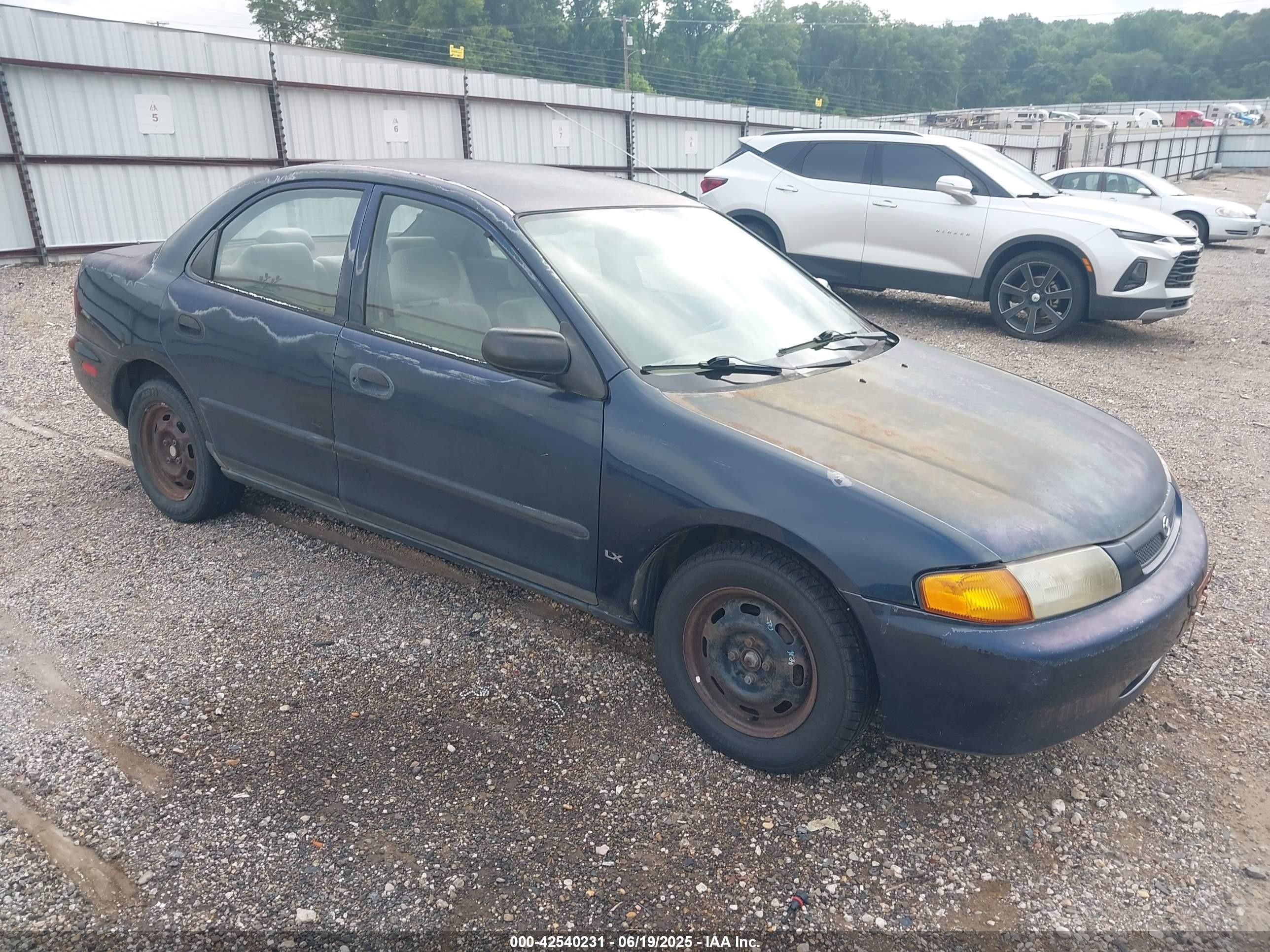 1998 Mazda Protege DX, VIN JM1BC1414W0231436 — Normal wear