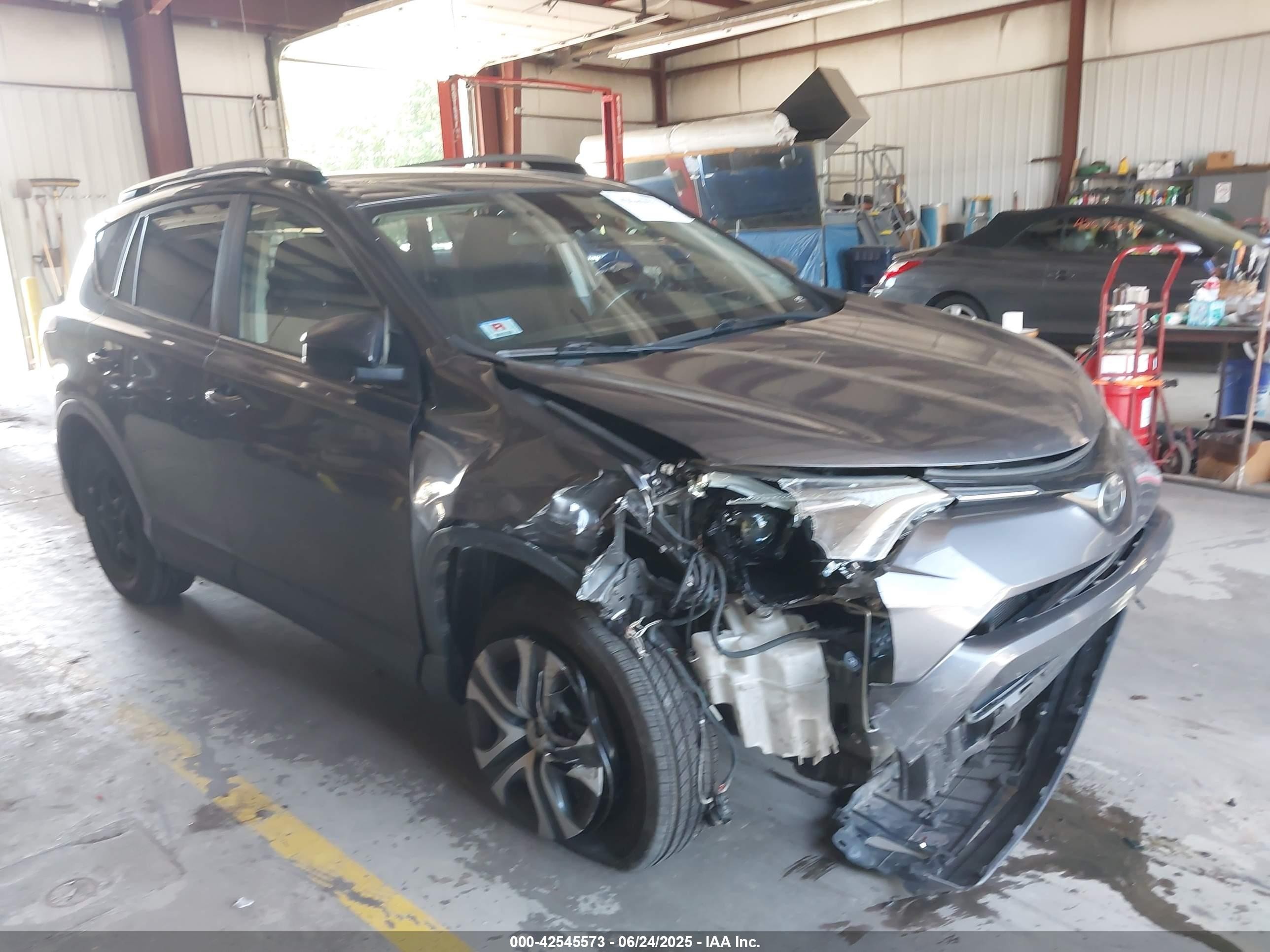 2017 Toyota RAV4 LE, VIN JTMBFREV5HJ110595 — Front end