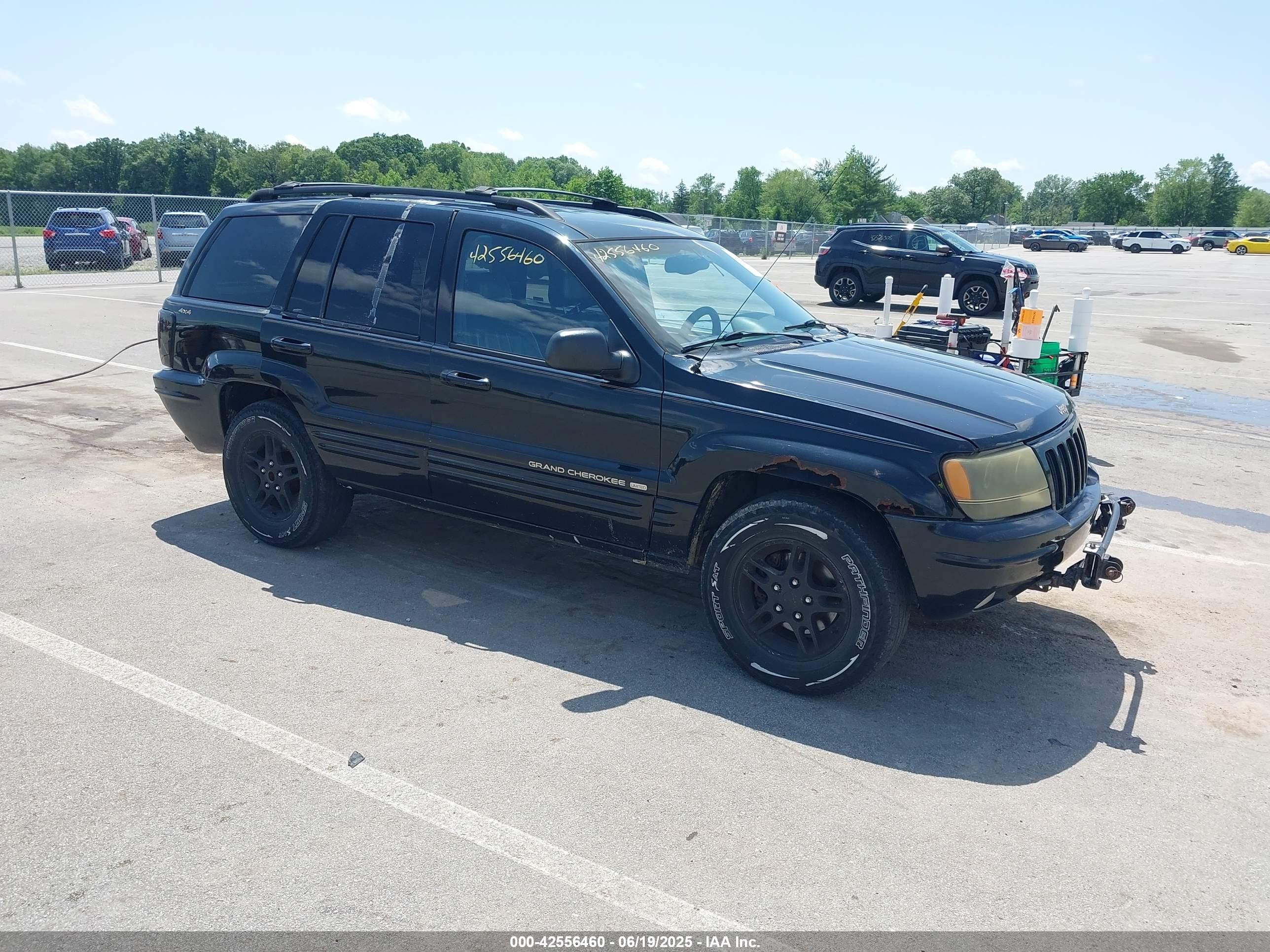 1999 Jeep Grand Cherokee Limited, VIN 1J4GW68N6XC614389 — Side