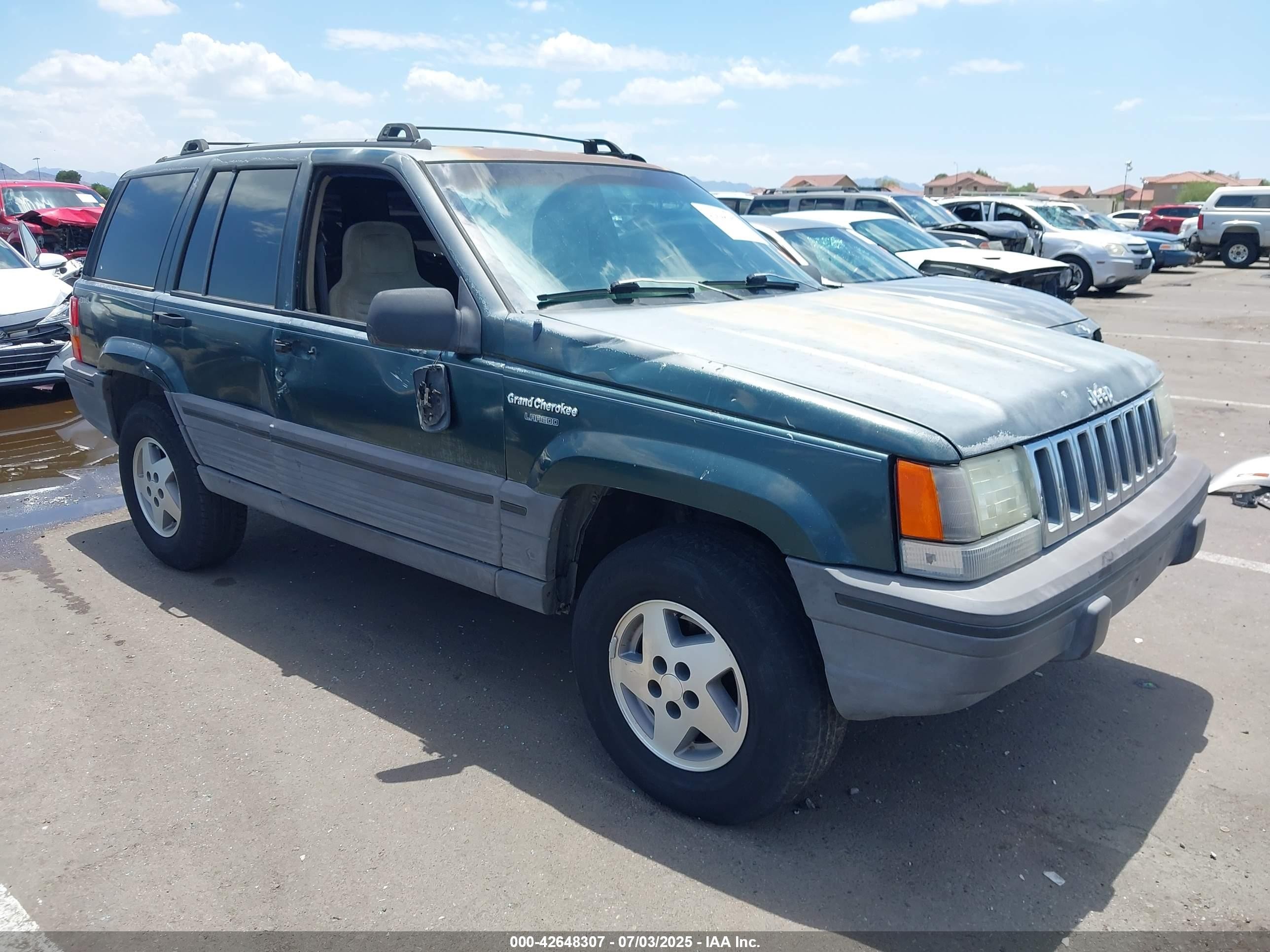 1993 Jeep Grand Cherokee Laredo, VIN 1J4GZ58S3PC637099 — Side
