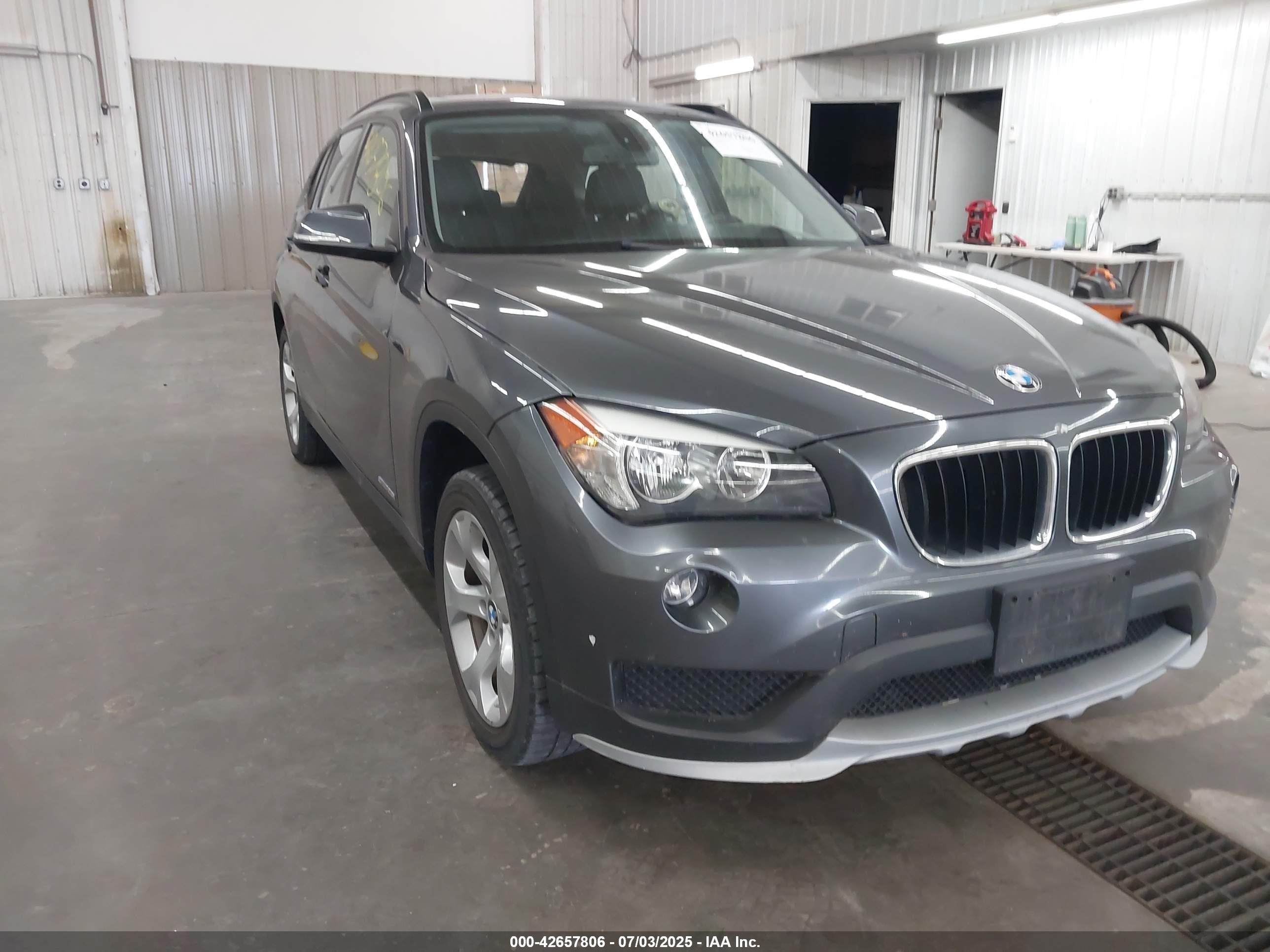2015 BMW X1 sDrive28i, VIN WBAVM1C53FVW58699 — Storm