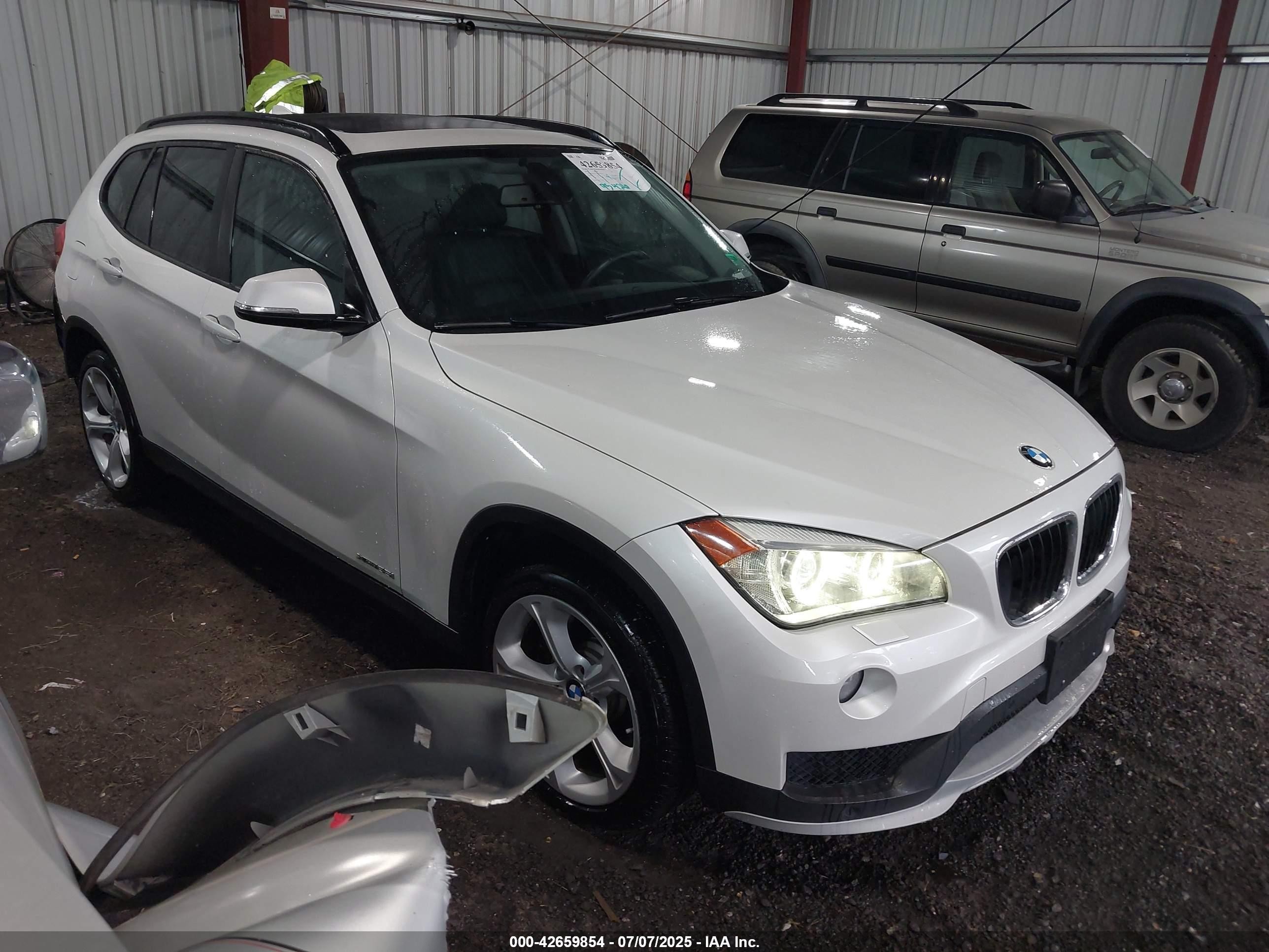 2015 BMW X1 xDrive35i, VIN WBAVM5C56FVV93550 — Rear end