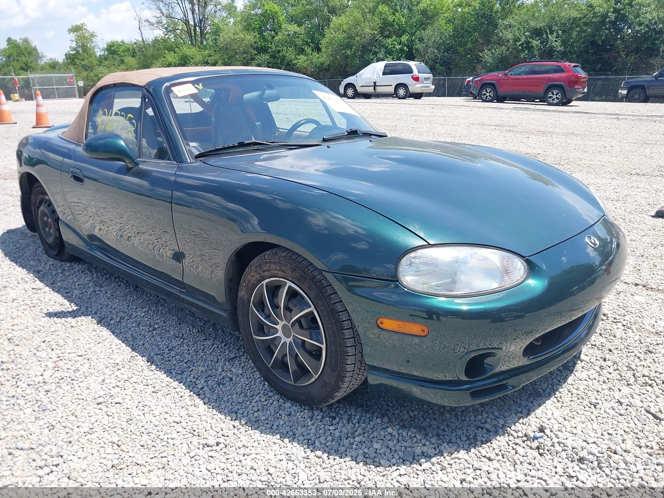 1999 Mazda MX-5 Miata, VIN JM1NB3531X0136720 — Side