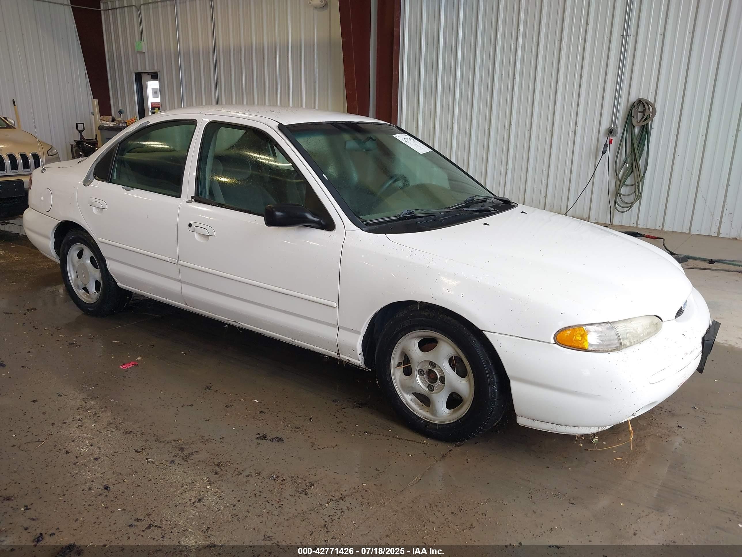 1997 Ford Contour LX, VIN 1FALP6537VK132379 — Side