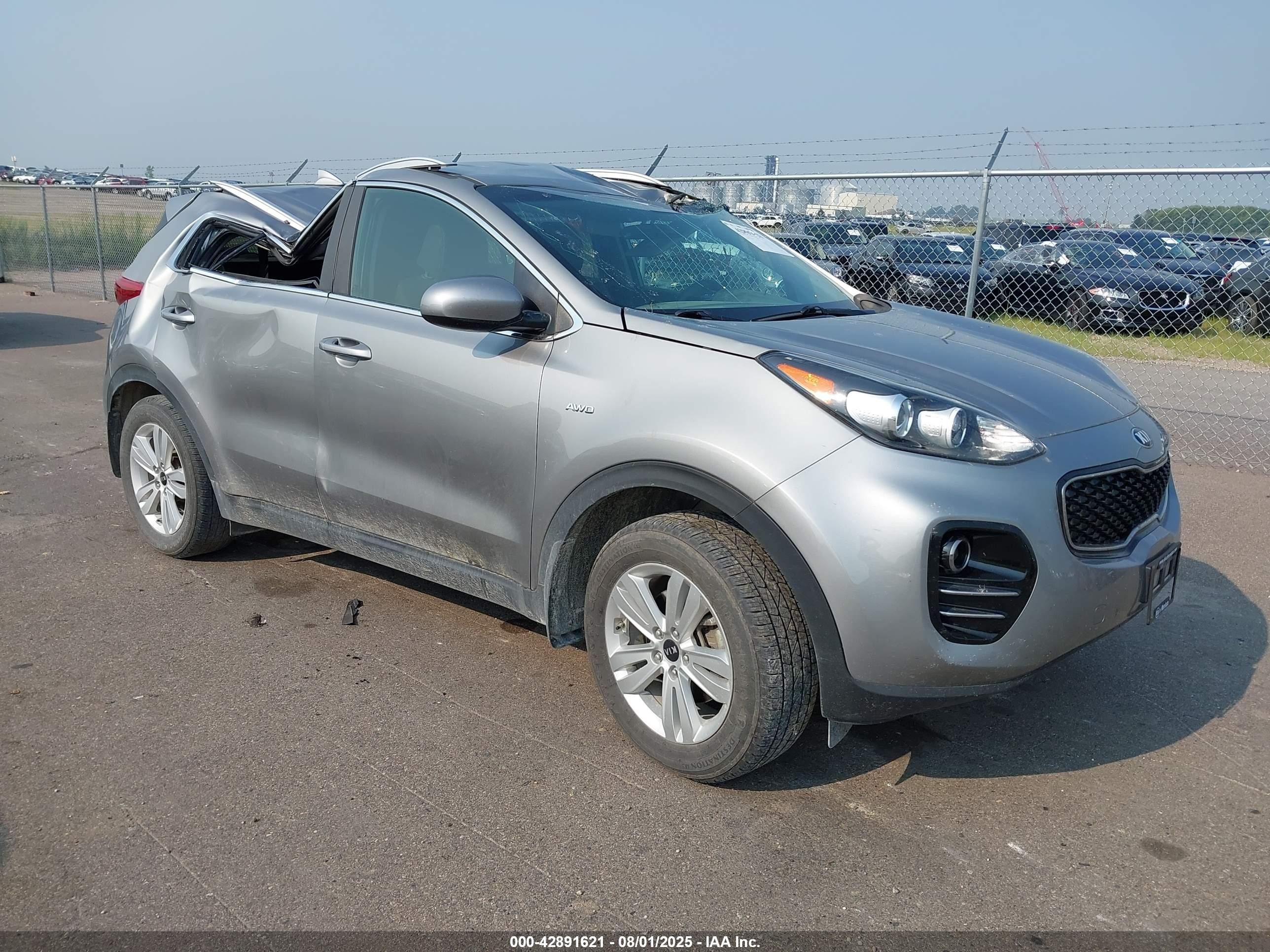 2019 Kia Sportage LX, VIN KNDPMCACXK7597942 — Storm