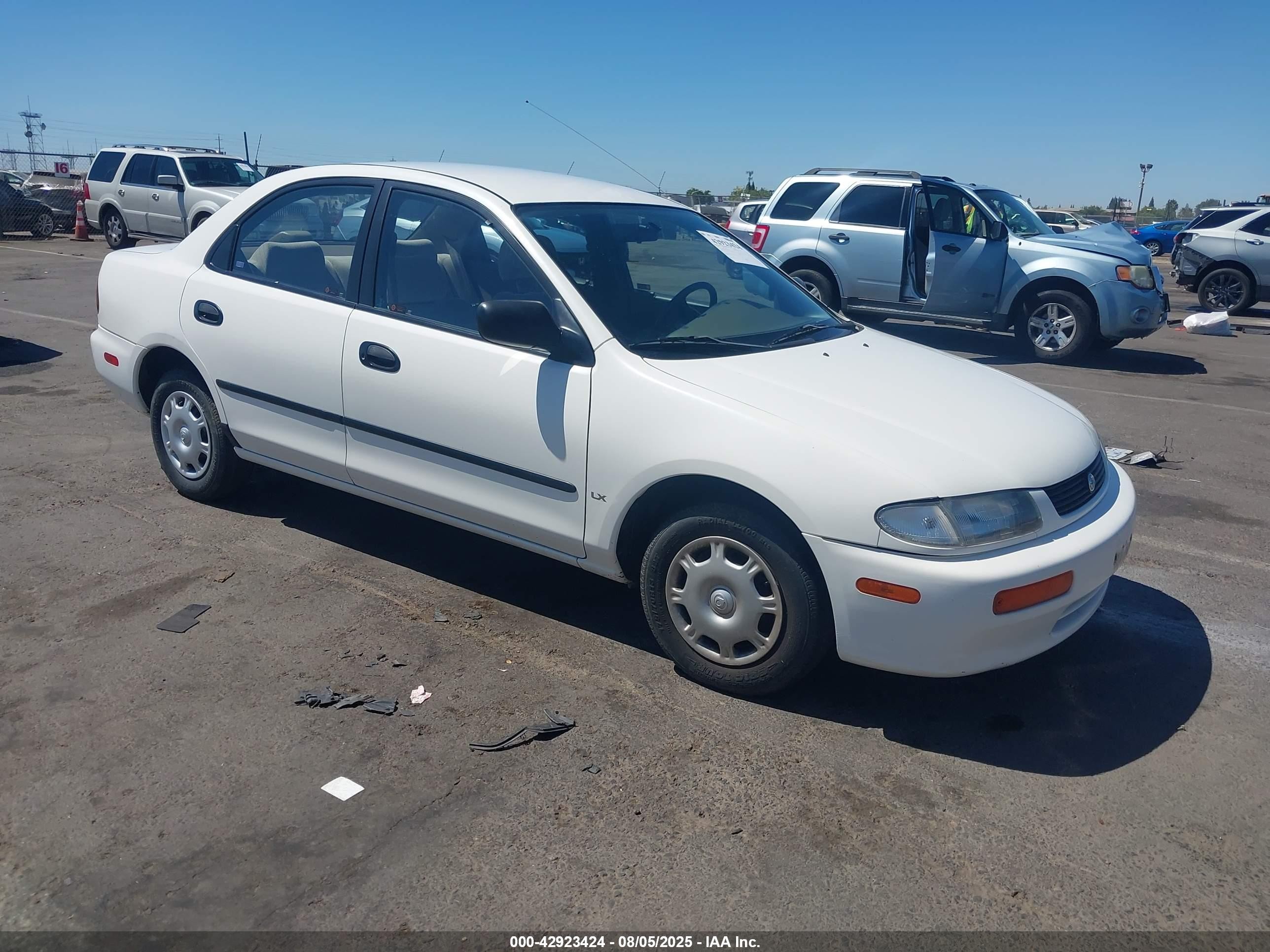 1995 Mazda Protege, VIN JM1BA1414S0163896 — Пожар