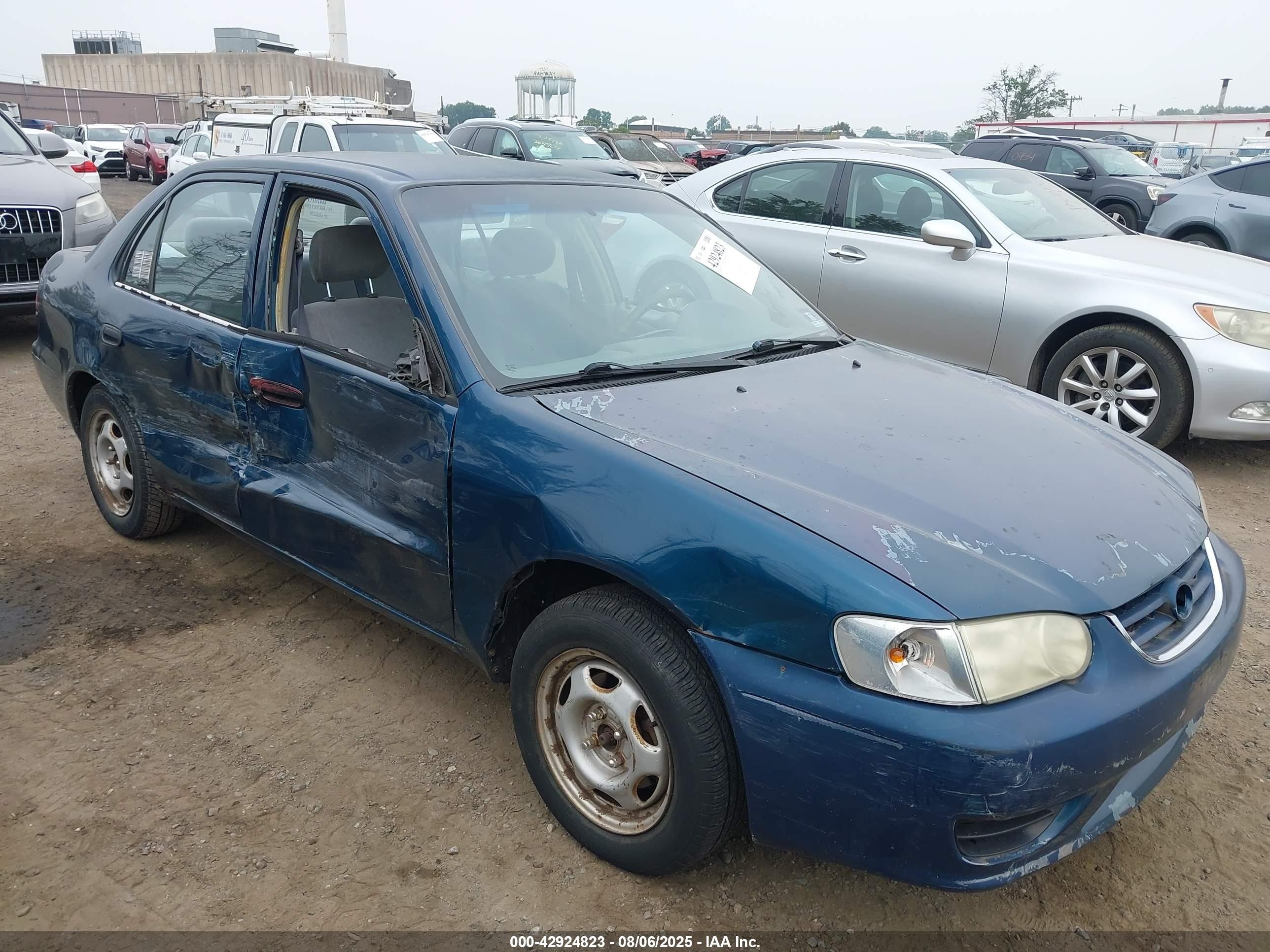 2001 Toyota Corolla LE, VIN 1NXBR12E21Z555969 — Side