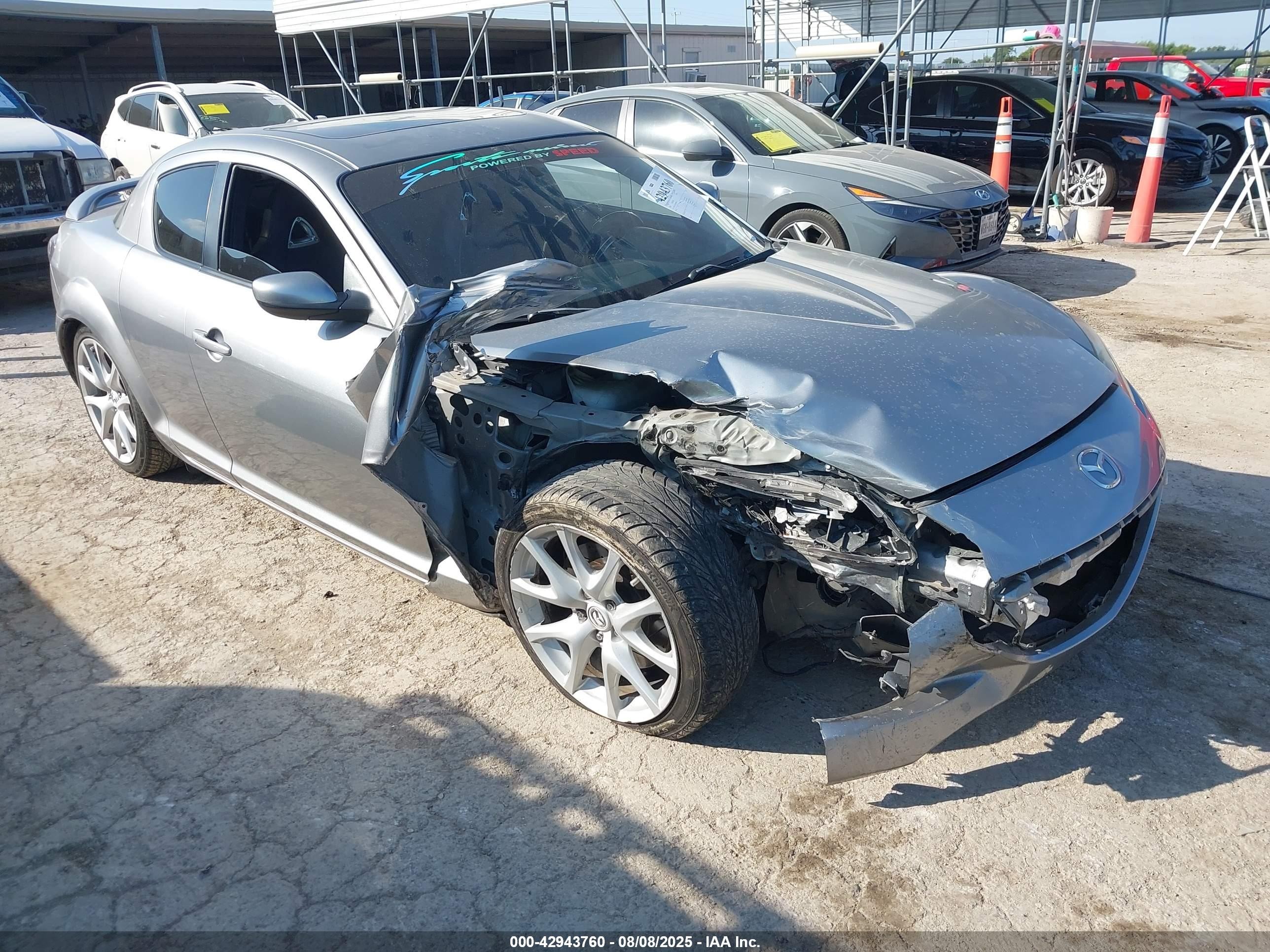 2010 Mazda RX-8 Grand Touring, VIN JM1FE1CP5A0404648 — Side