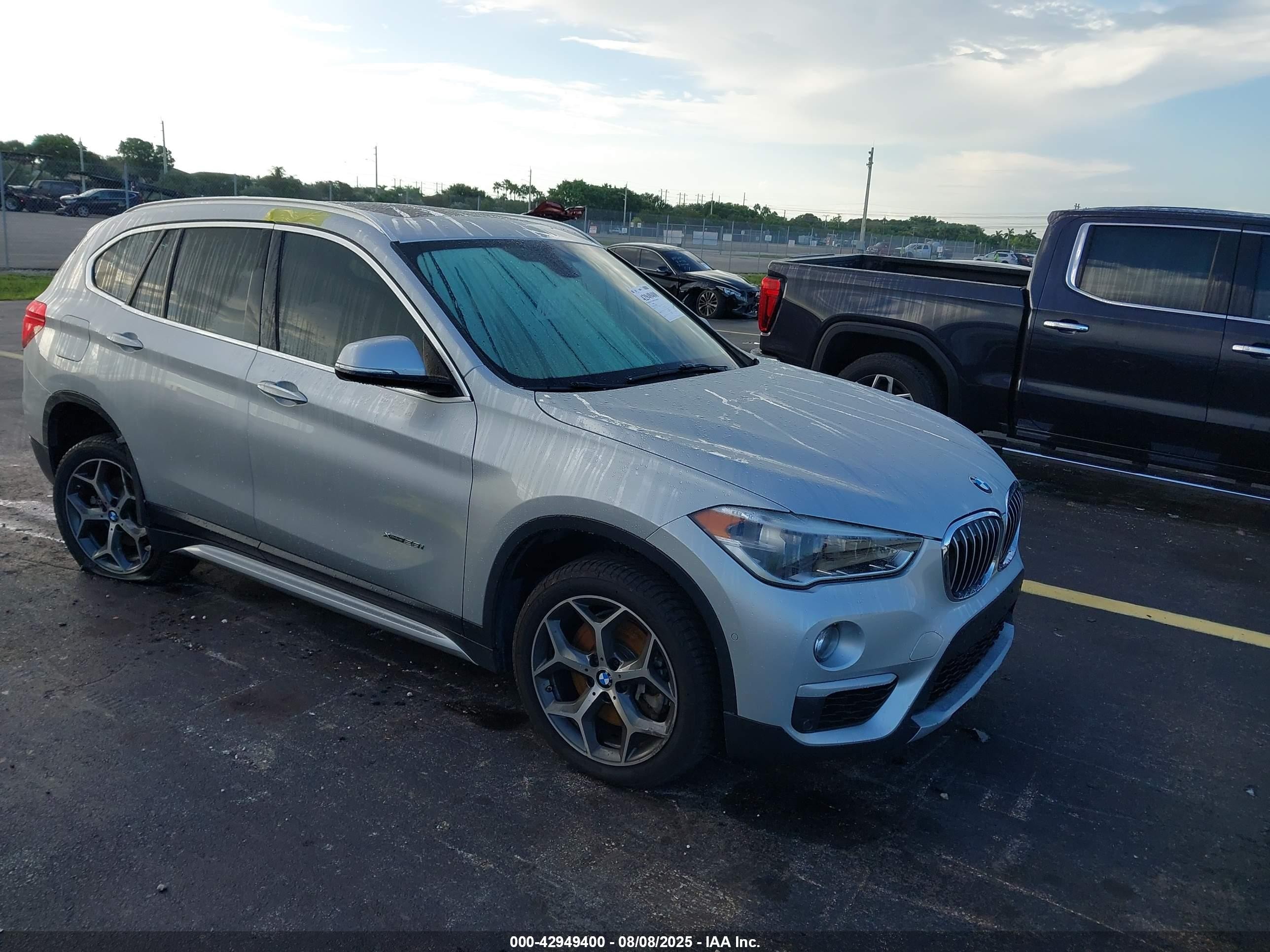 2017 BMW X1 xDrive28i, VIN WBXHT3C32H5F74203 — Rear end