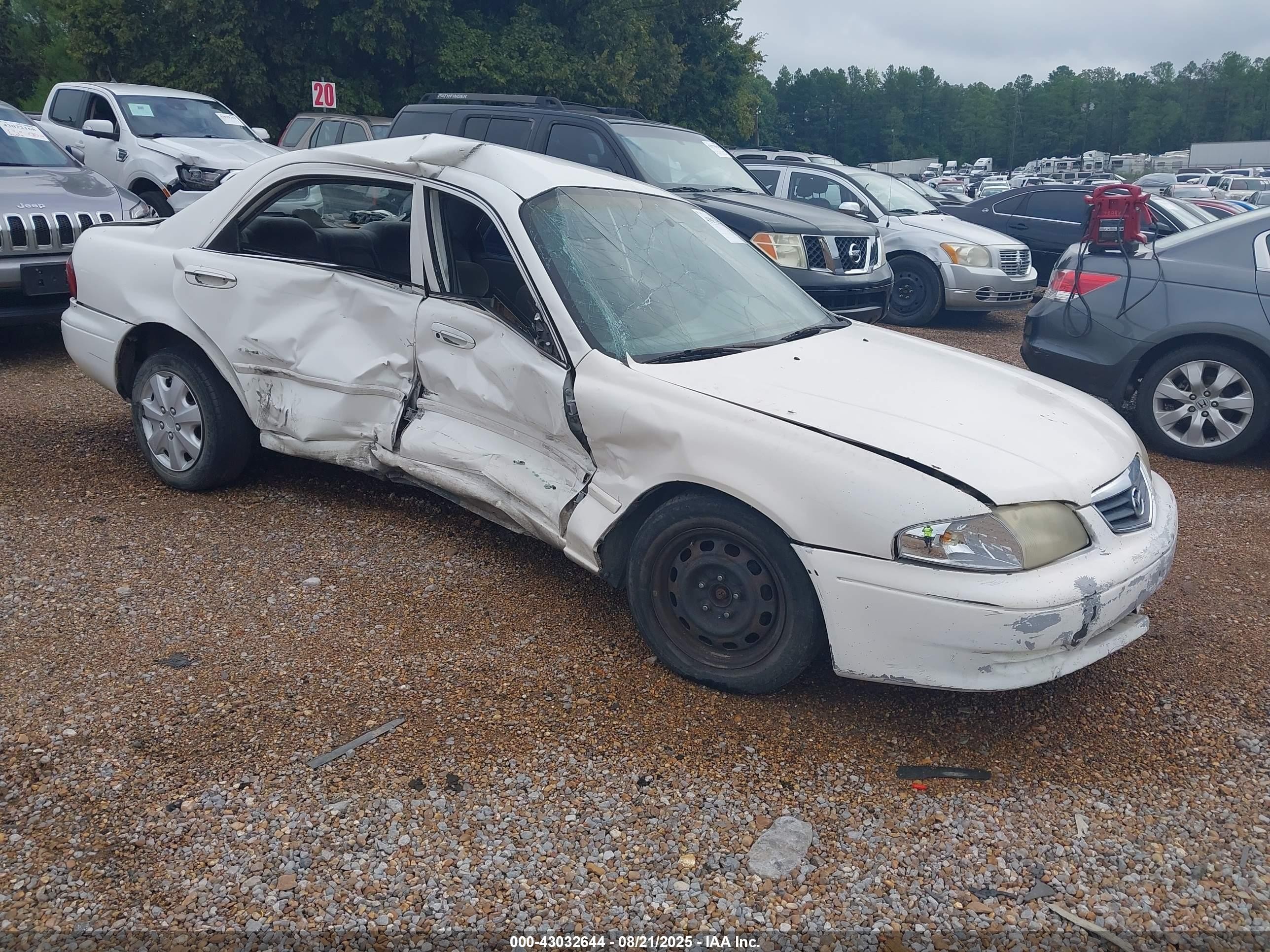 2000 Mazda 626 LX, VIN 1YVGF22CXY5148732 — Side